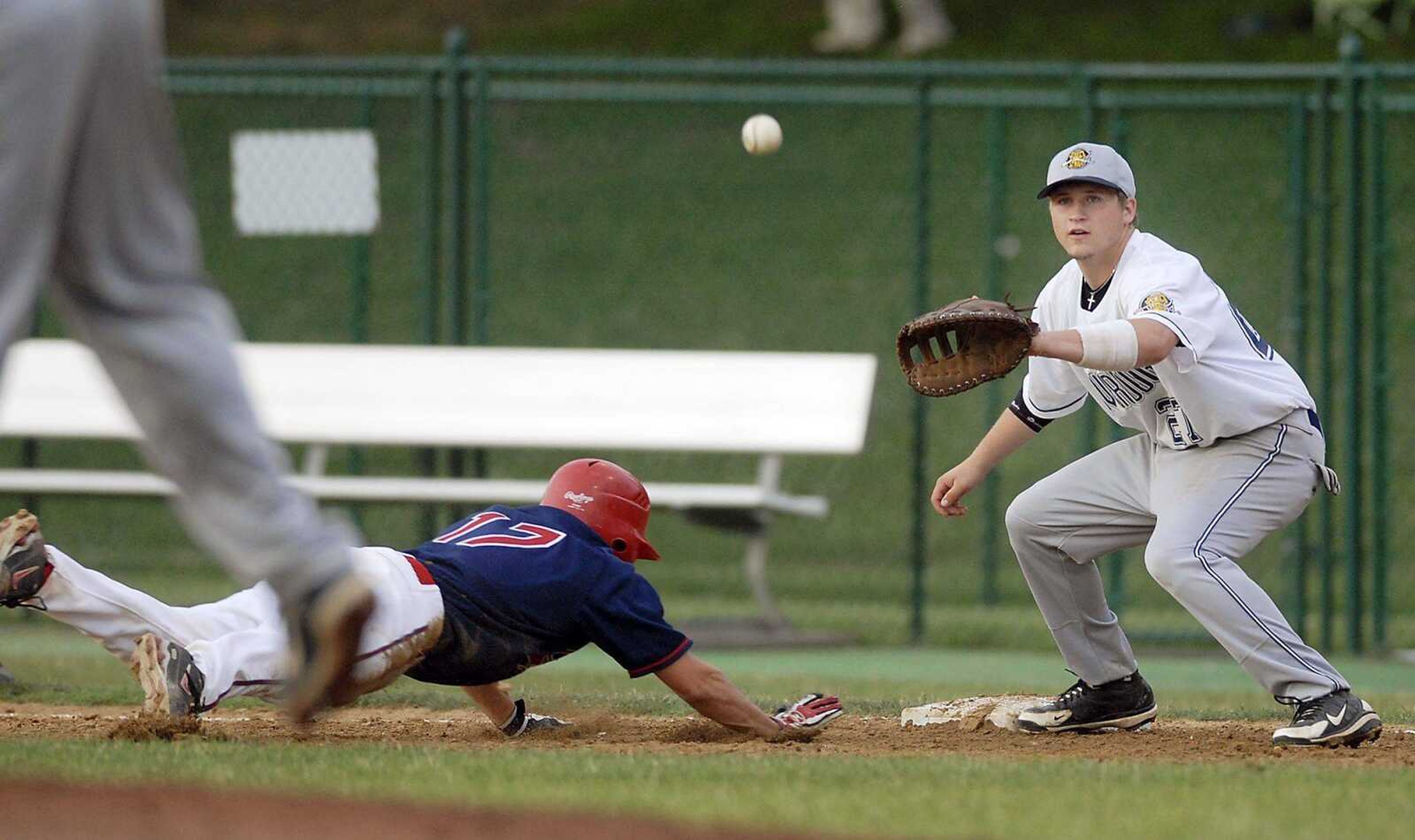 Capahas baserunner Drew Pixley beats the pickoff throw to Charleston first baseman Caleb Guilliams during Friday's game at Capaha Field. (Kit Doyle)