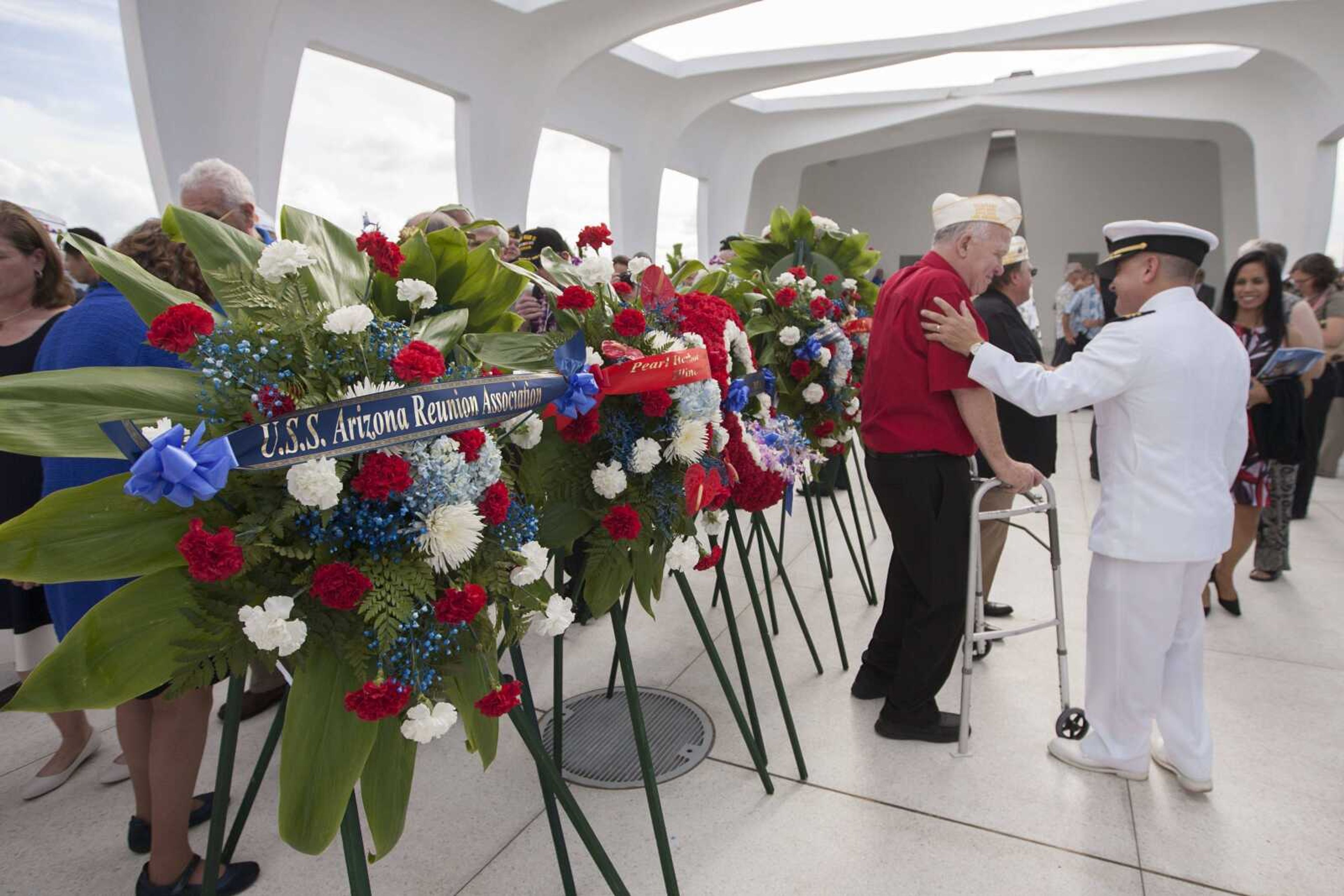 Various memorial wreaths decorate the USS Arizona Memorial on Wednesday at Joint Base Pearl Harbor-Hickam in Honolulu.