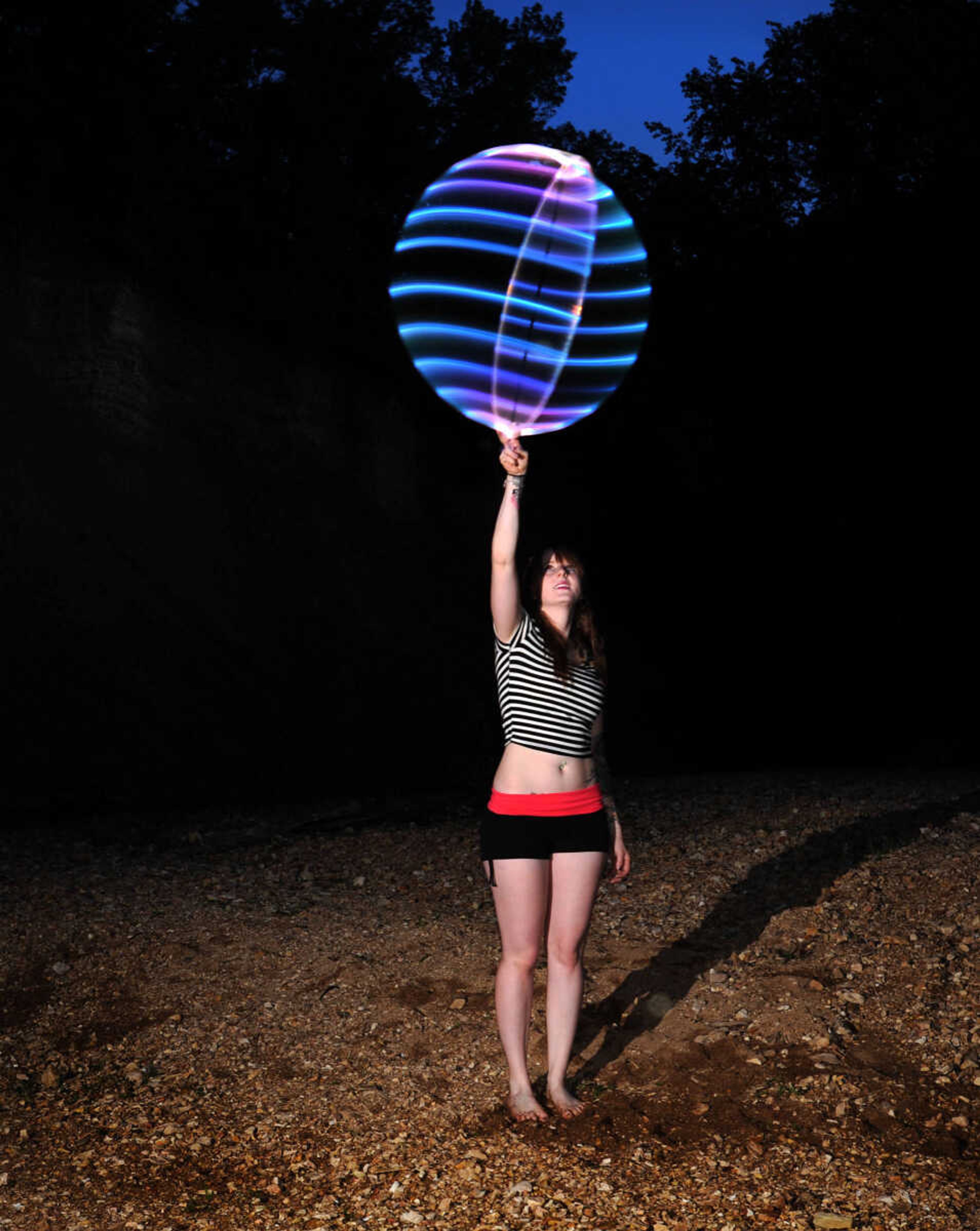 LAURA SIMON ~ lsimon@semissourian.com

Chelsie Welker hoop dances with an LED hoop in a Cape Girardeau County creek, Tuesday, May 26, 2015.