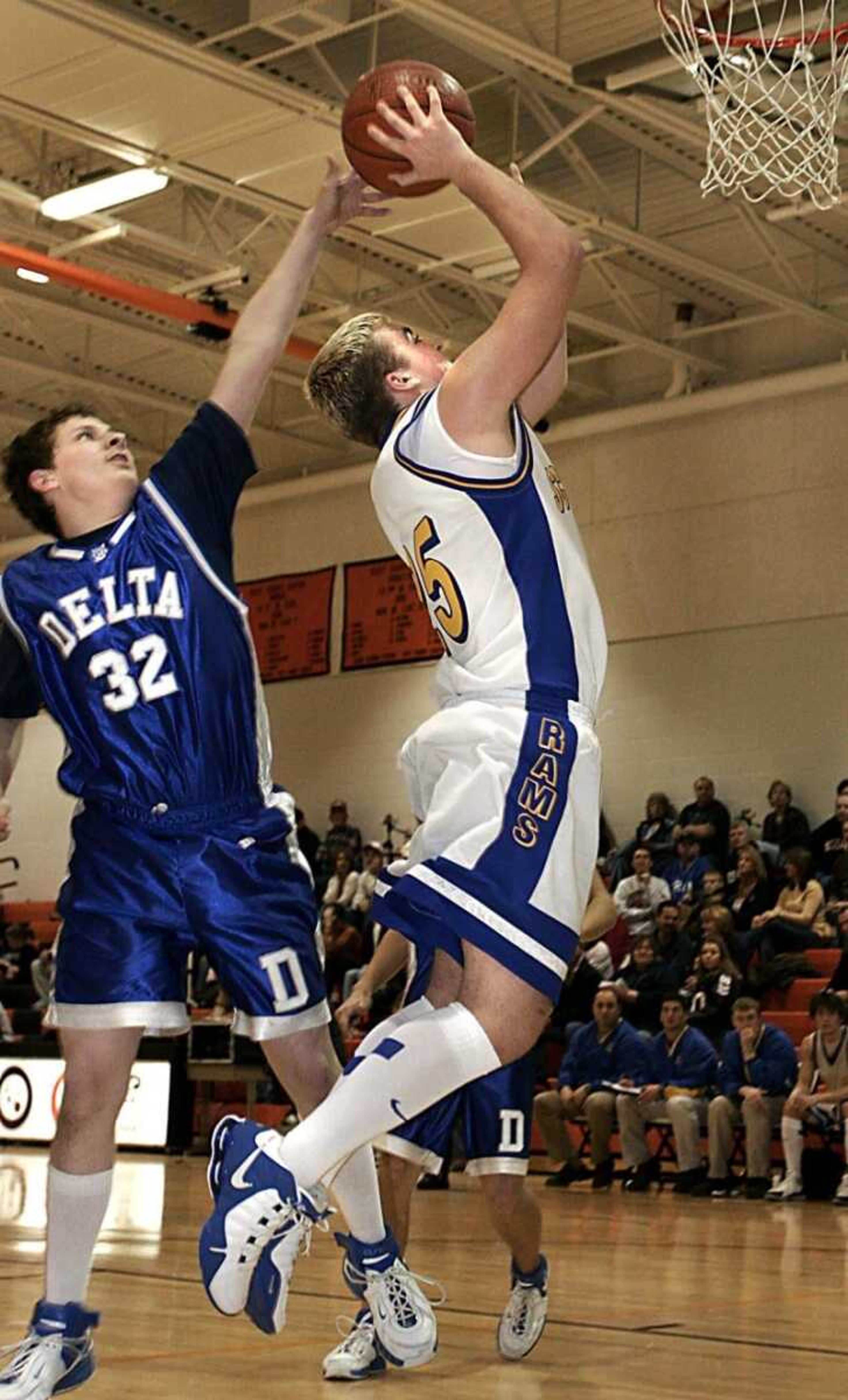 Delta's Joe Easley fouled Scott City's Derek Laxton during Tuesday's first-round game in the Scott-Mississippi Conference Tournament at Scott County Central High School. Scott City won 67-24. (Kit Doyle)