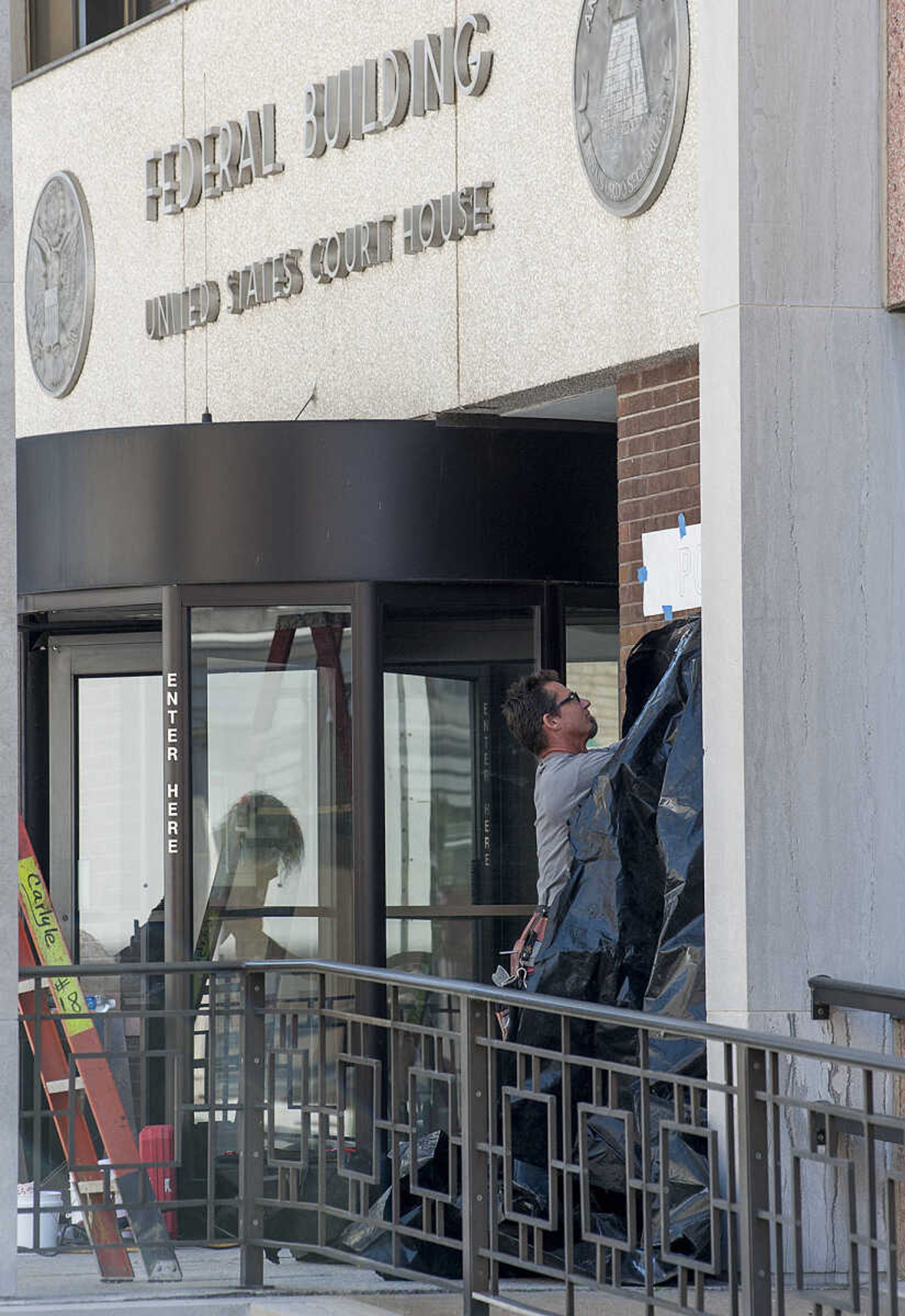 ADAM VOGLER ~ avogler@semissourian.com
Crew members for the 20th Century Fox's feature film "Gone Girl" work to transform the old Federal Building on Broadway into the headquarters of the fictional North Carthage Police Department Friday, Sept. 27, in Cape Girardeau.