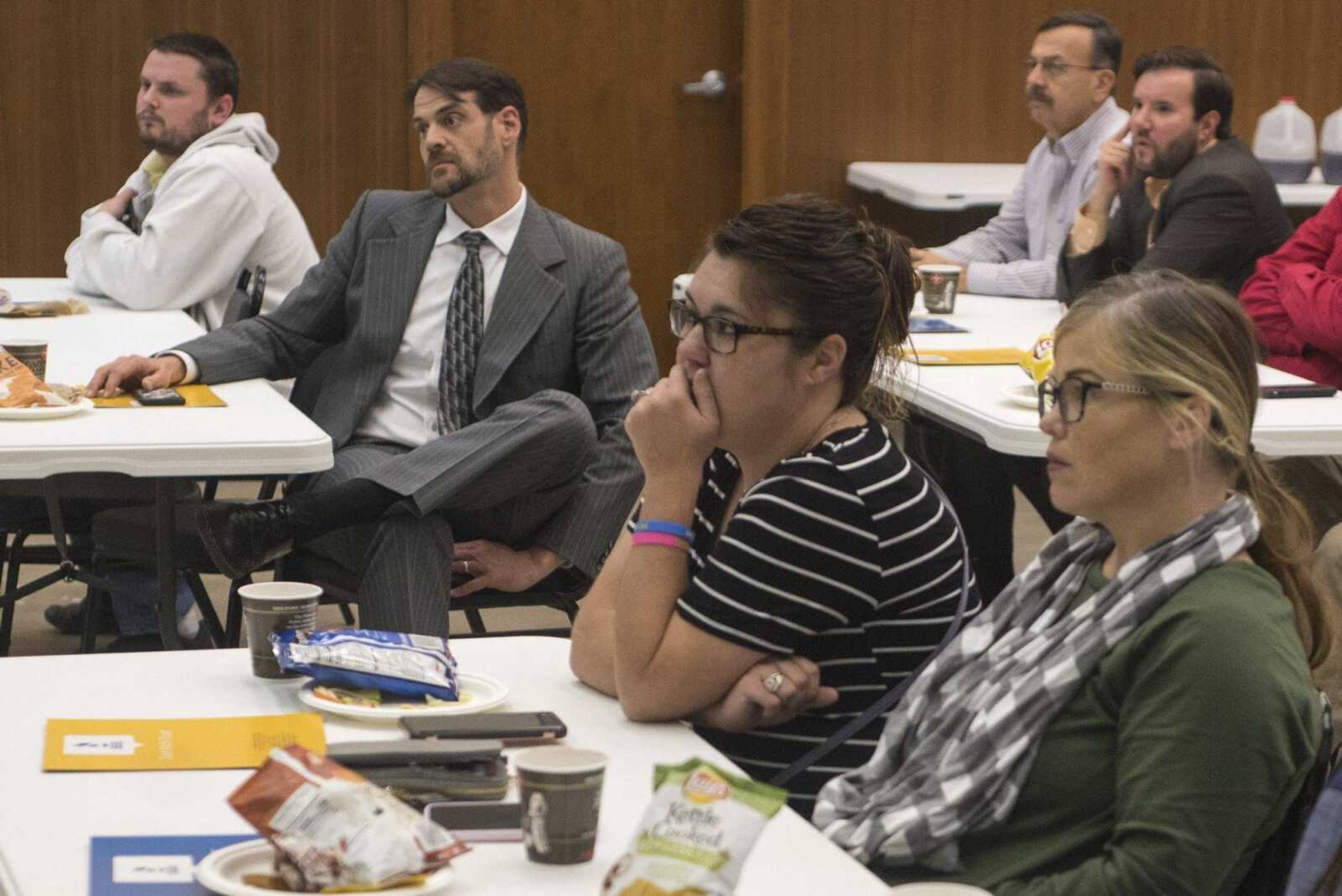 Luncheon attendees listen as FBI special agent Monique Comeau of St. Louis speaks about cybersecurity Thursday to attendees of a Better Business Bureau luncheon inside the former federal building at 339 Broadway in Cape Girardeau.