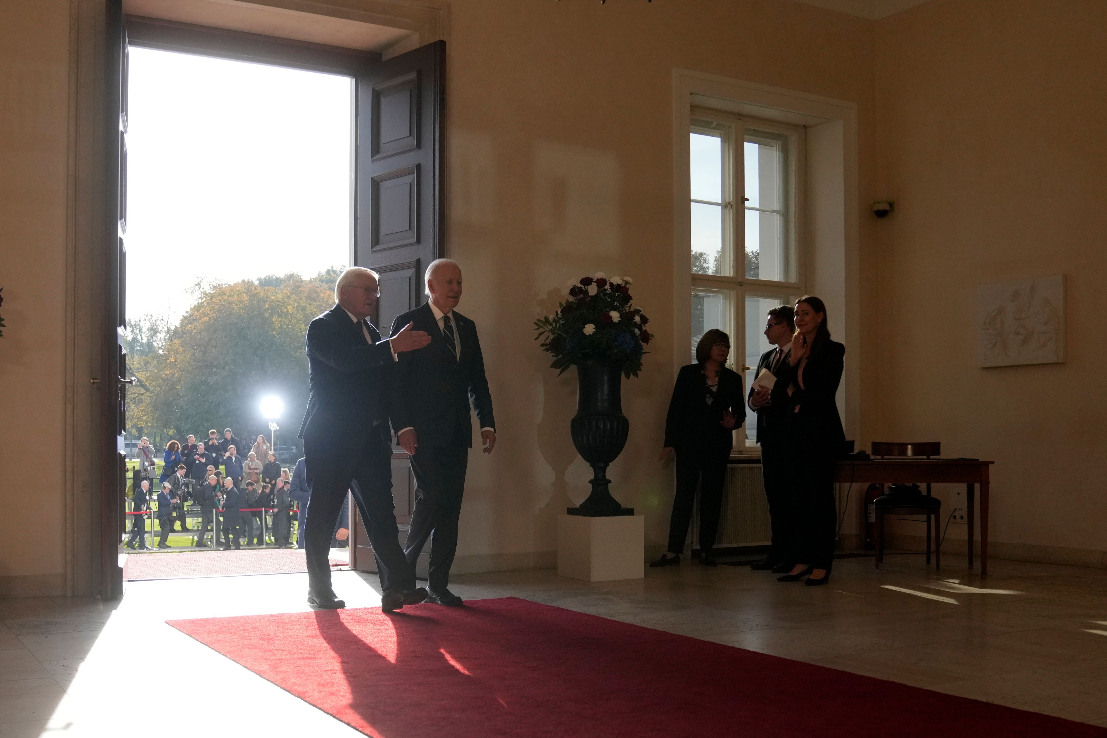 President Joe Biden arrives beside German President Frank-Walter Steinmeier for signing a guest book during the welcoming ceremony at Bellevue Palace in Berlin, Germany, Friday, Oct. 18, 2024. (AP Photo/Markus Schreiber)