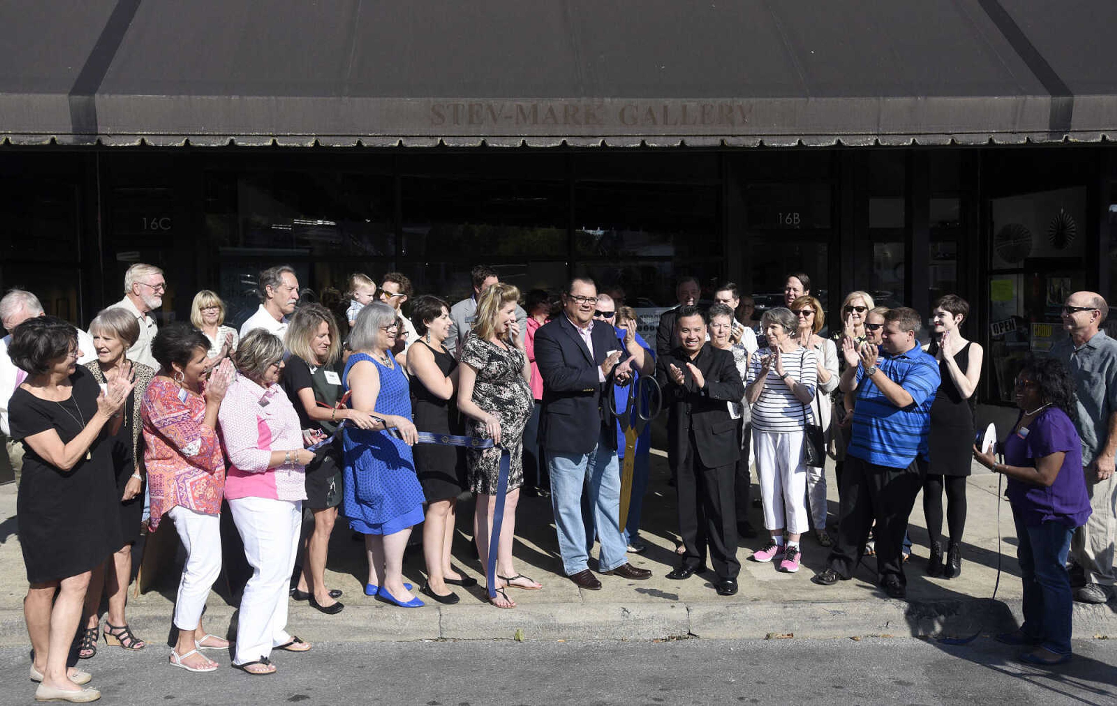 LAURA SIMON ~ lsimon@semissourian.com

The ribbon is cut during the grand opening reception for the 4th annual Members Exhibit at the Arts Council of Southeast Missouri in its new location at 16 North Spanish Street in downtown Cape Girardeau on Friday, Sept. 2, 2016.