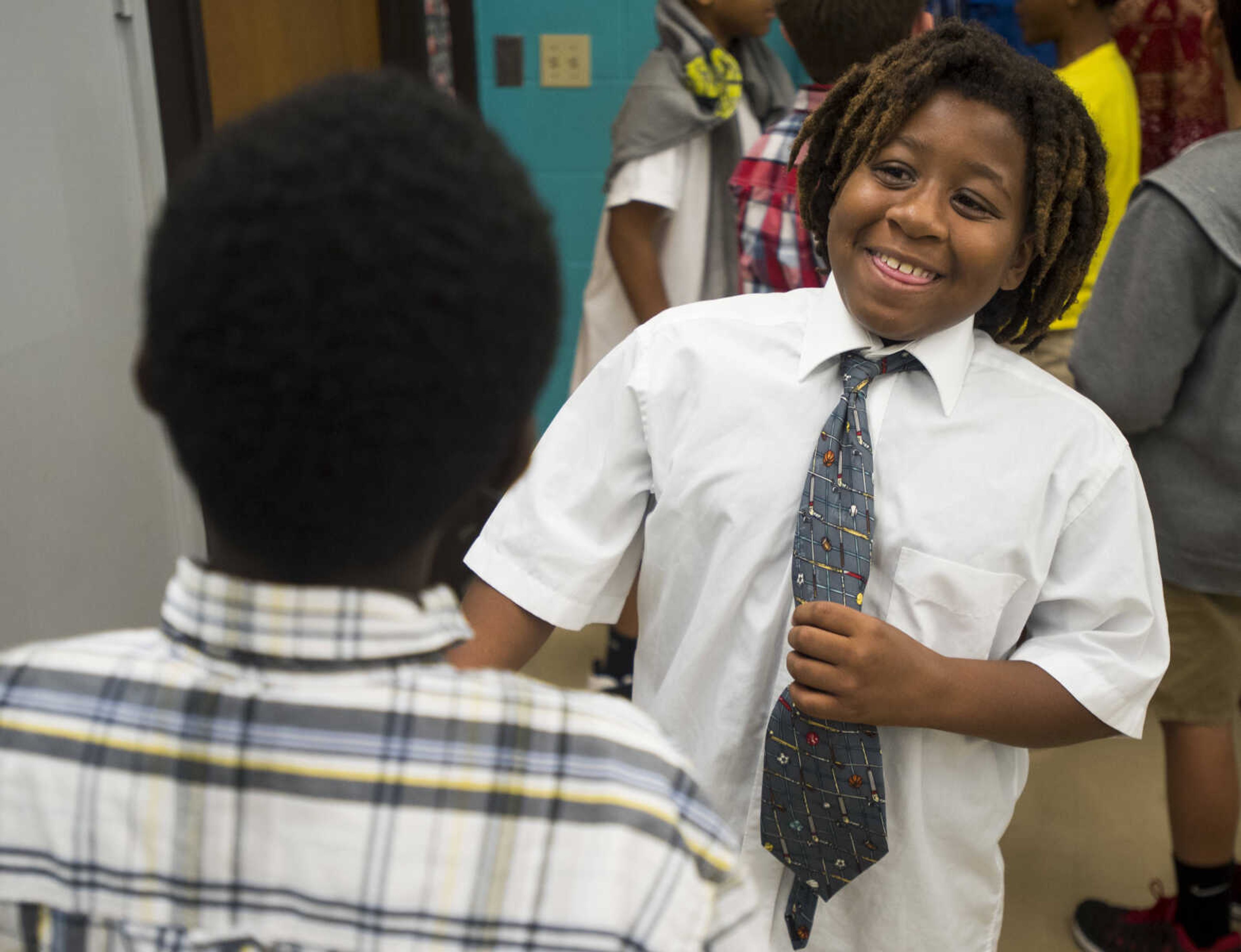 Keynote Jolliff, 11, right, talks to Lemuel Gilbert, 11, after a Honorable Young Men's Club meeting Sept. 19, 2017 at Central Middle School in Cape Girardeau.