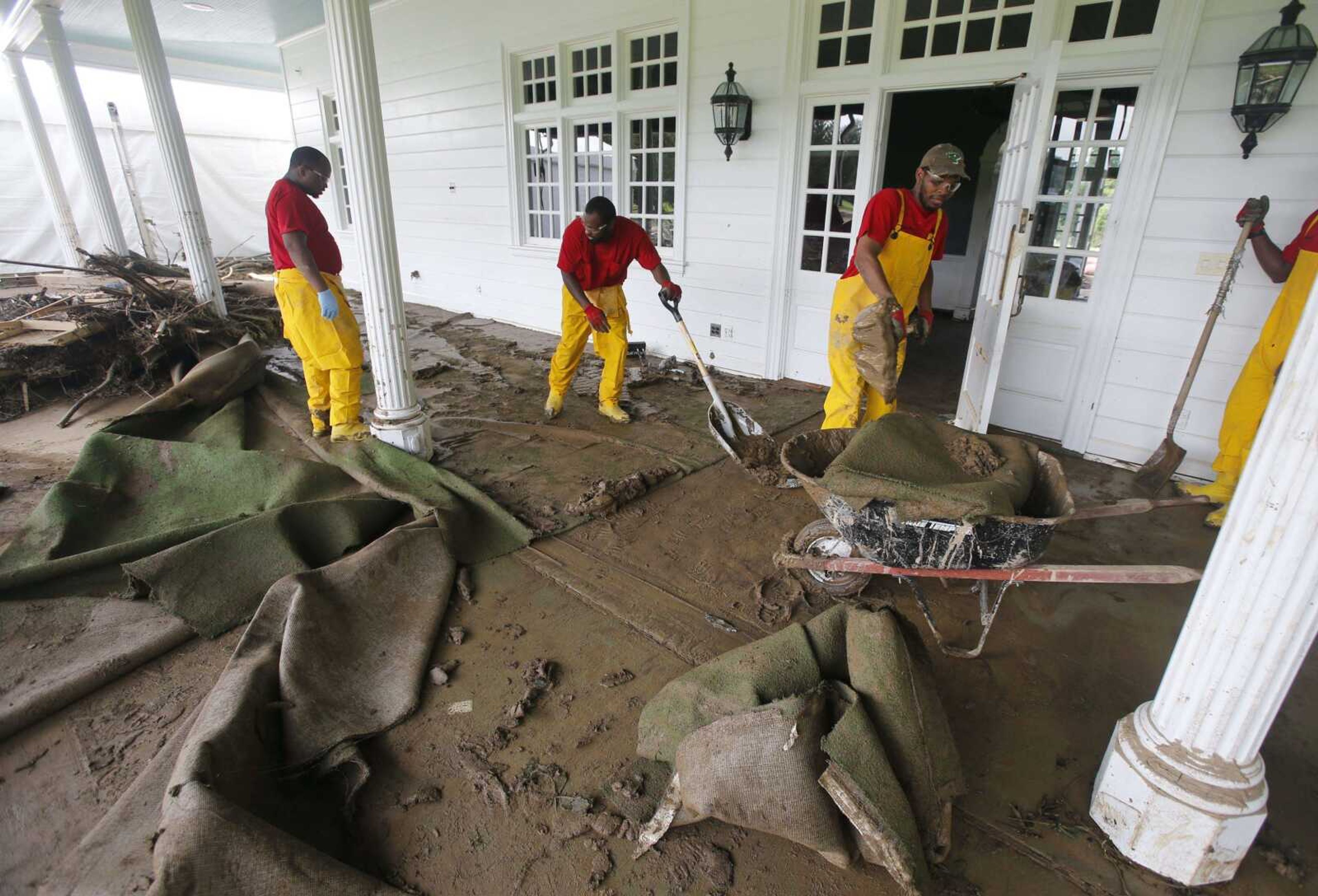 Debris is stacked up as workers begin cleanup at the Greenbrier Resort in White Sulphur Springs, West Virginia.