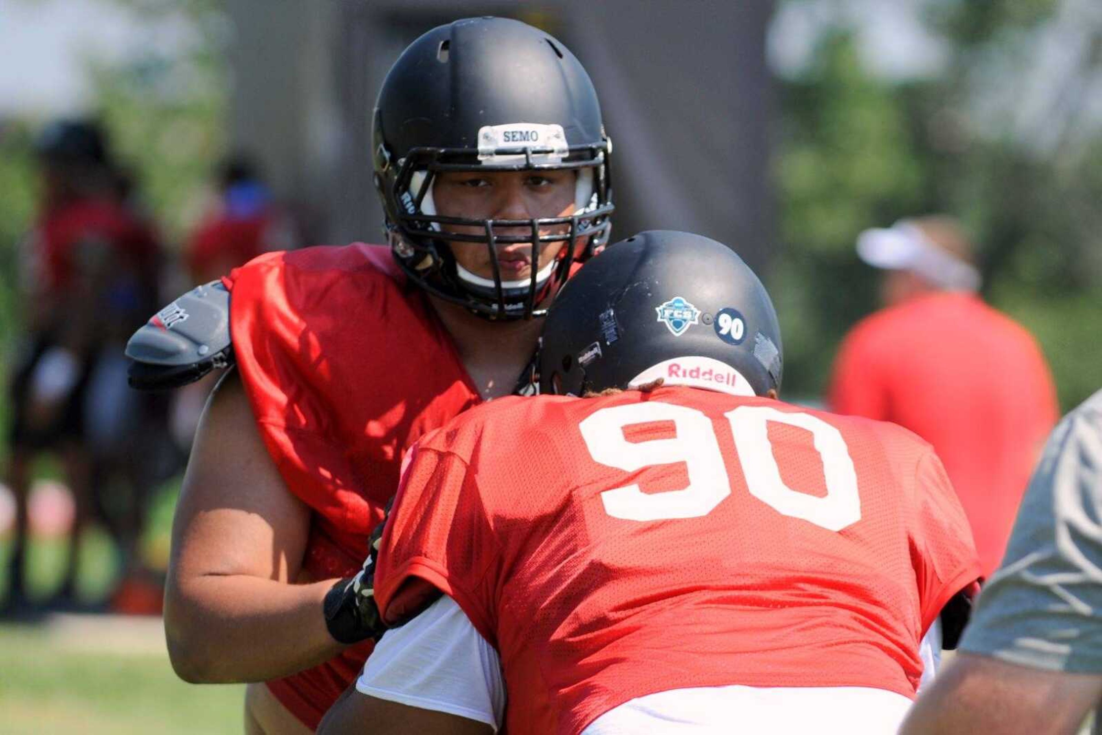 Southeast Missouri State defensive lineman Devin Hebert works a drill with nose tackle Anthony Cheatum during practice Wednesday, Aug. 10, 2016 at the Rosengarten Athletic Complex.