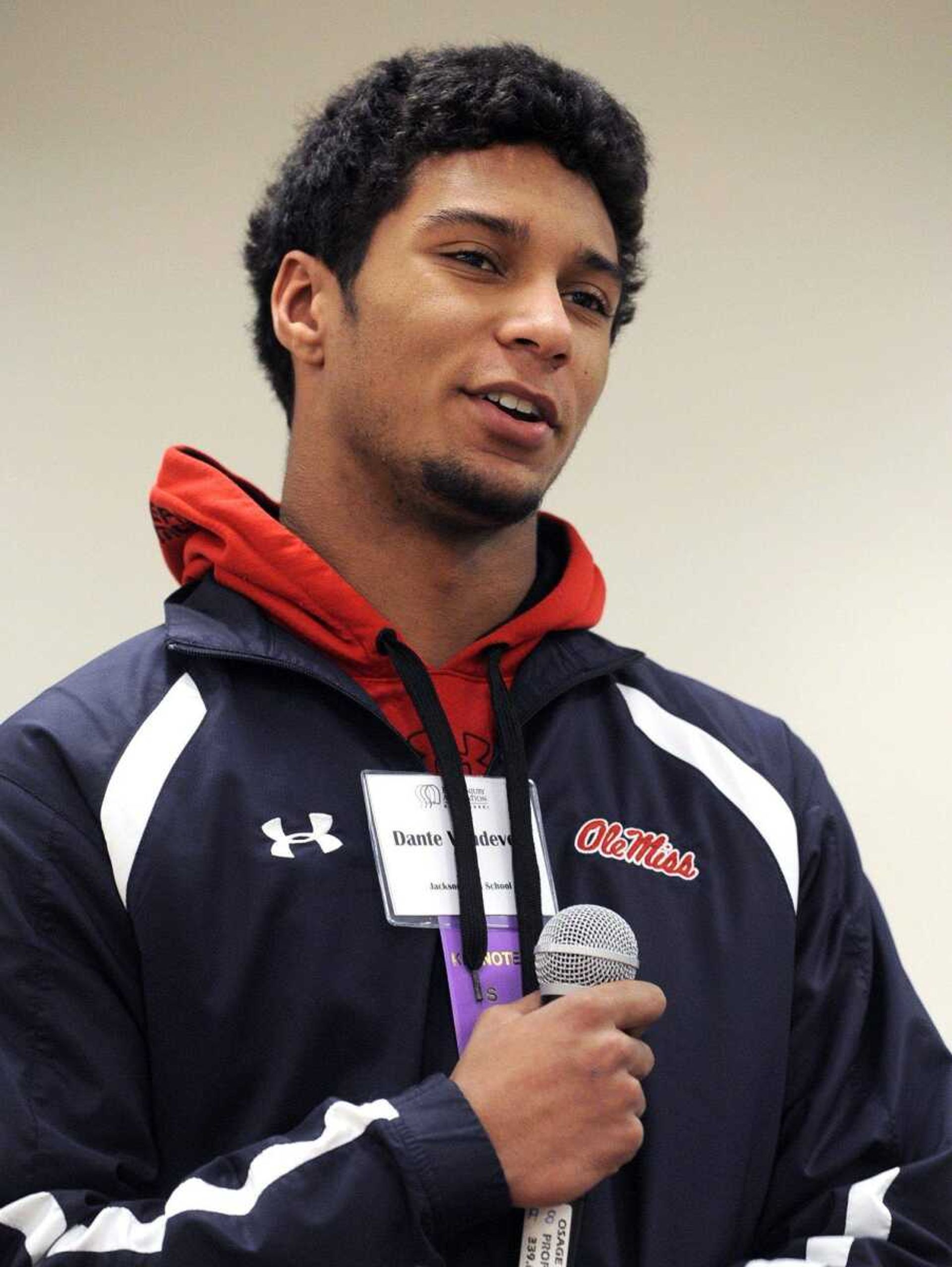 Jackson High School quarterback Dante Vandeven speaks Wednesday at the concussion seminar. Vandeven suffered a concussion last summer while relining a pool at his home. (Fred Lynch)