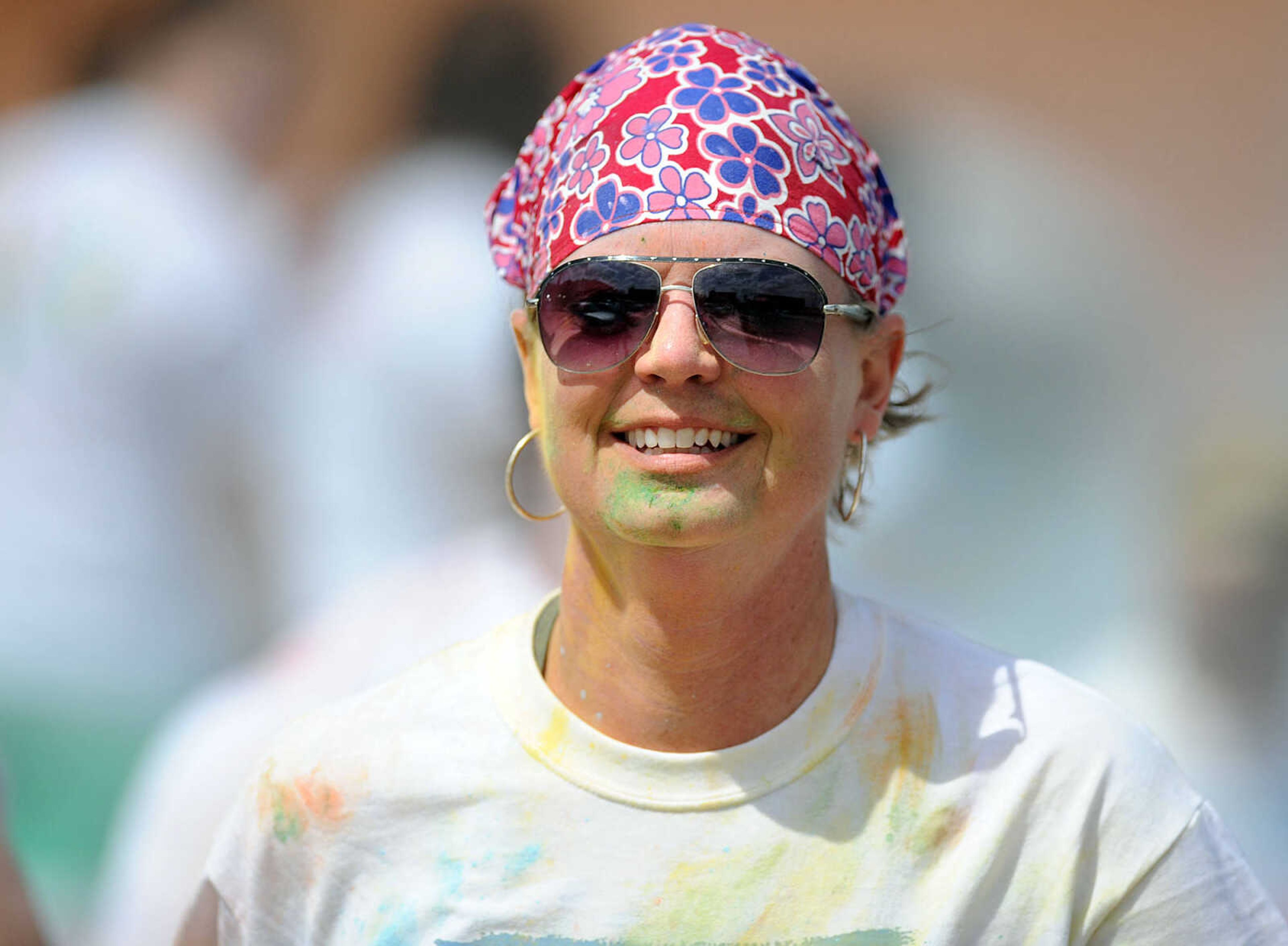 LAURA SIMON ~ lsimon@semissourian.com

Participants in the Color Me Cape 5K are sprayed with blue powder at the final color station on Main Street, Saturday, April 12, 2014, in Cape Girardeau.