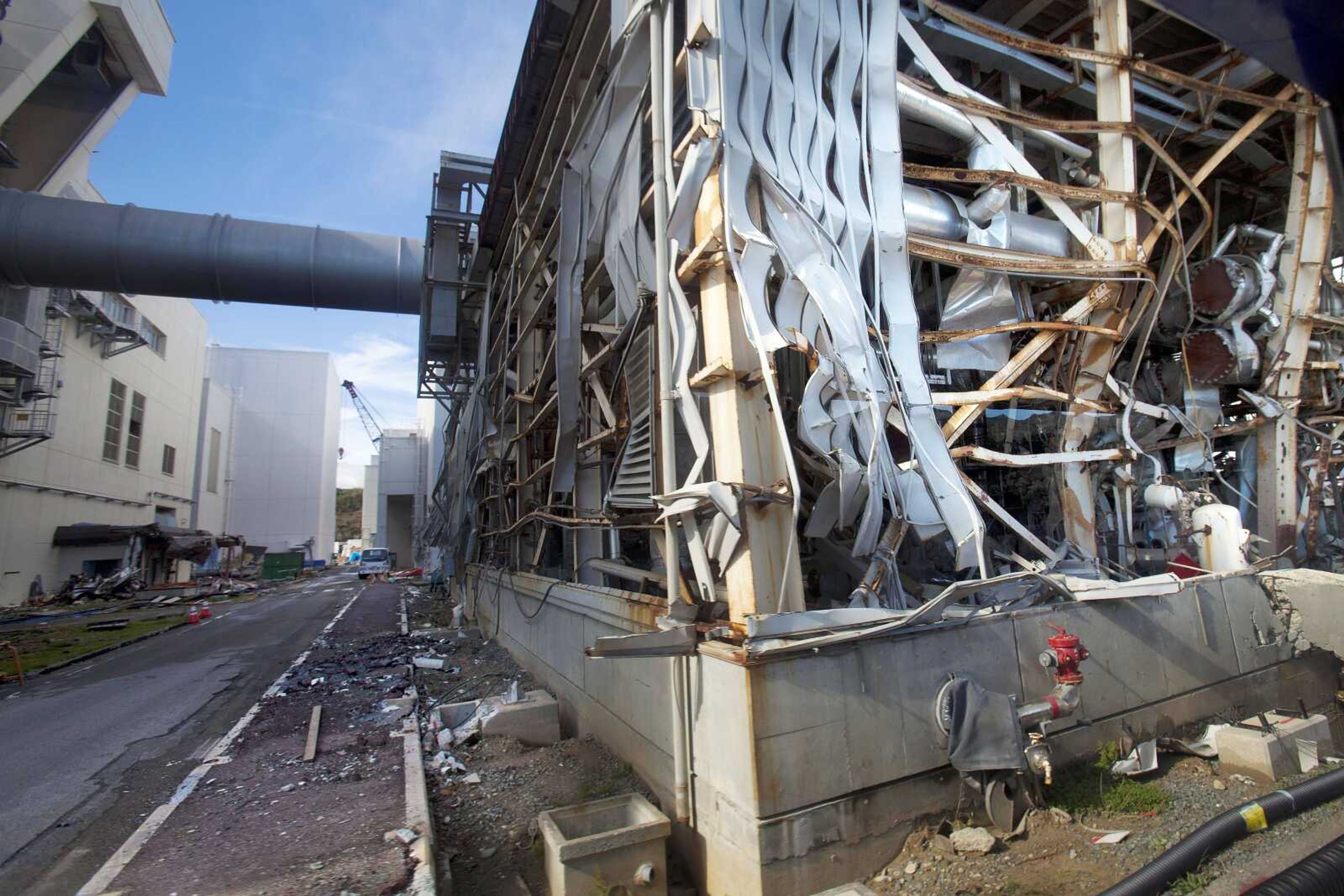 The crippled Fukushima Dai-ichi nuclear power station is seen through a bus window in Okuma, Japan, as the media were allowed Nov. 12 into Japan's tsunami-damaged nuclear power plant for the first time since the March 11 disaster. (Associated Press file)