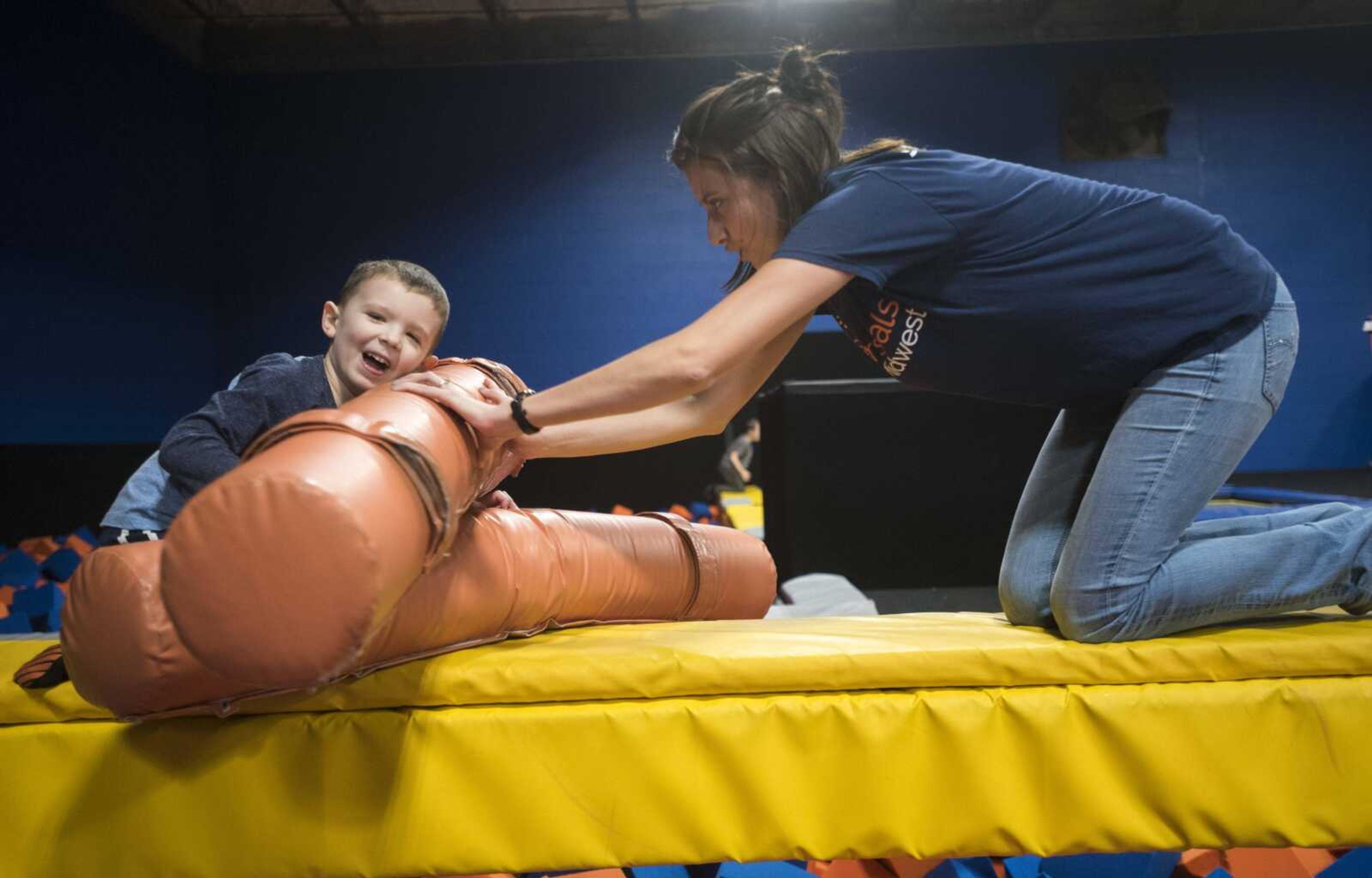 Vance Griffin, 4, plays with Easterseals Midwest transition coordinator Susan Owen during a group outing Tuesday, Feb. 13, 2018, at Ultimate Air Trampoline Park in Scott City.