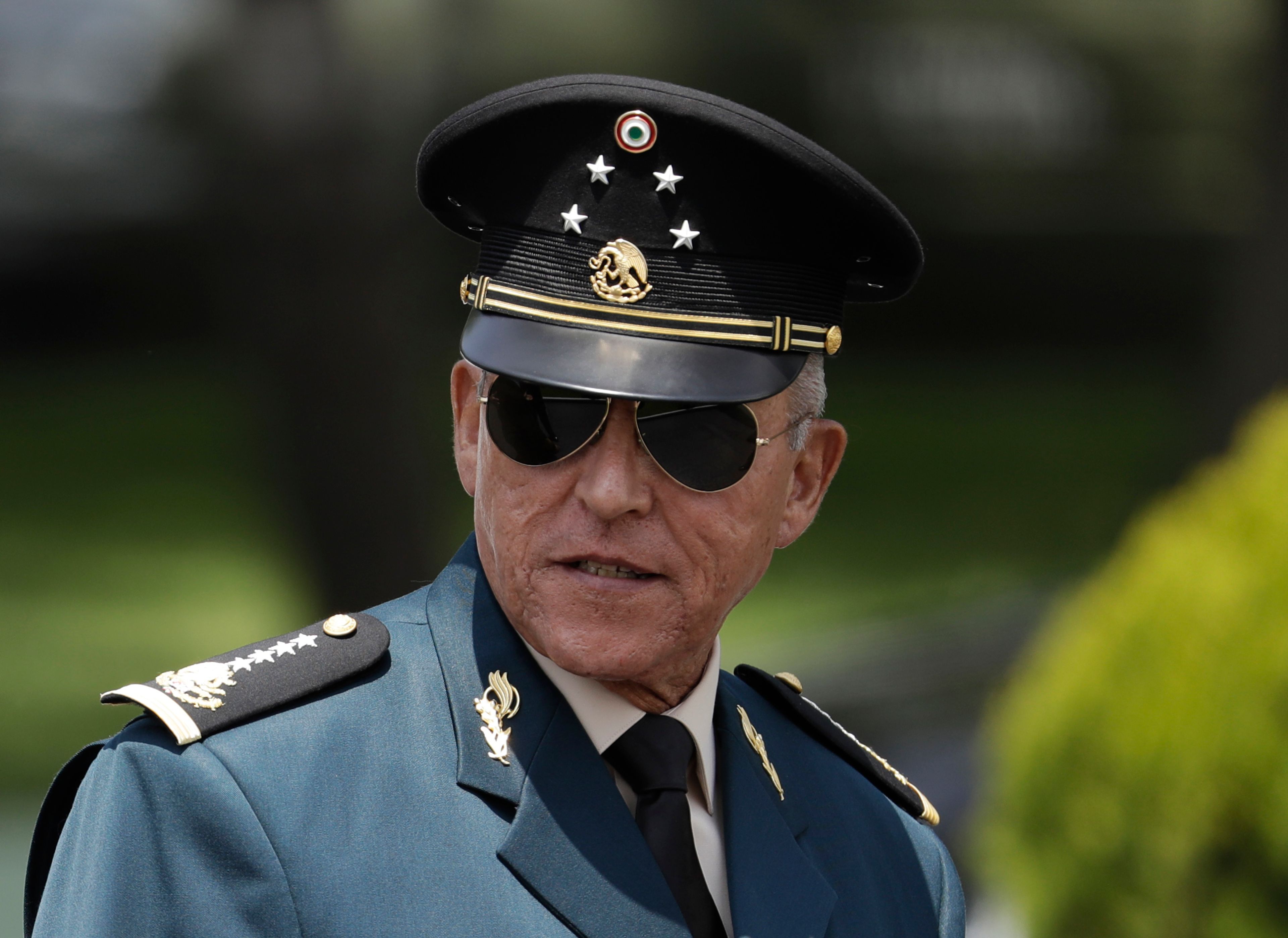 FILE - Secretary of Defense Salvador Cienfuegos arrives for a review of the troops that will participate in the Independence Day parade, in Mexico City, Sept. 14, 2016. (AP Photo/Rebecca Blackwell, File)