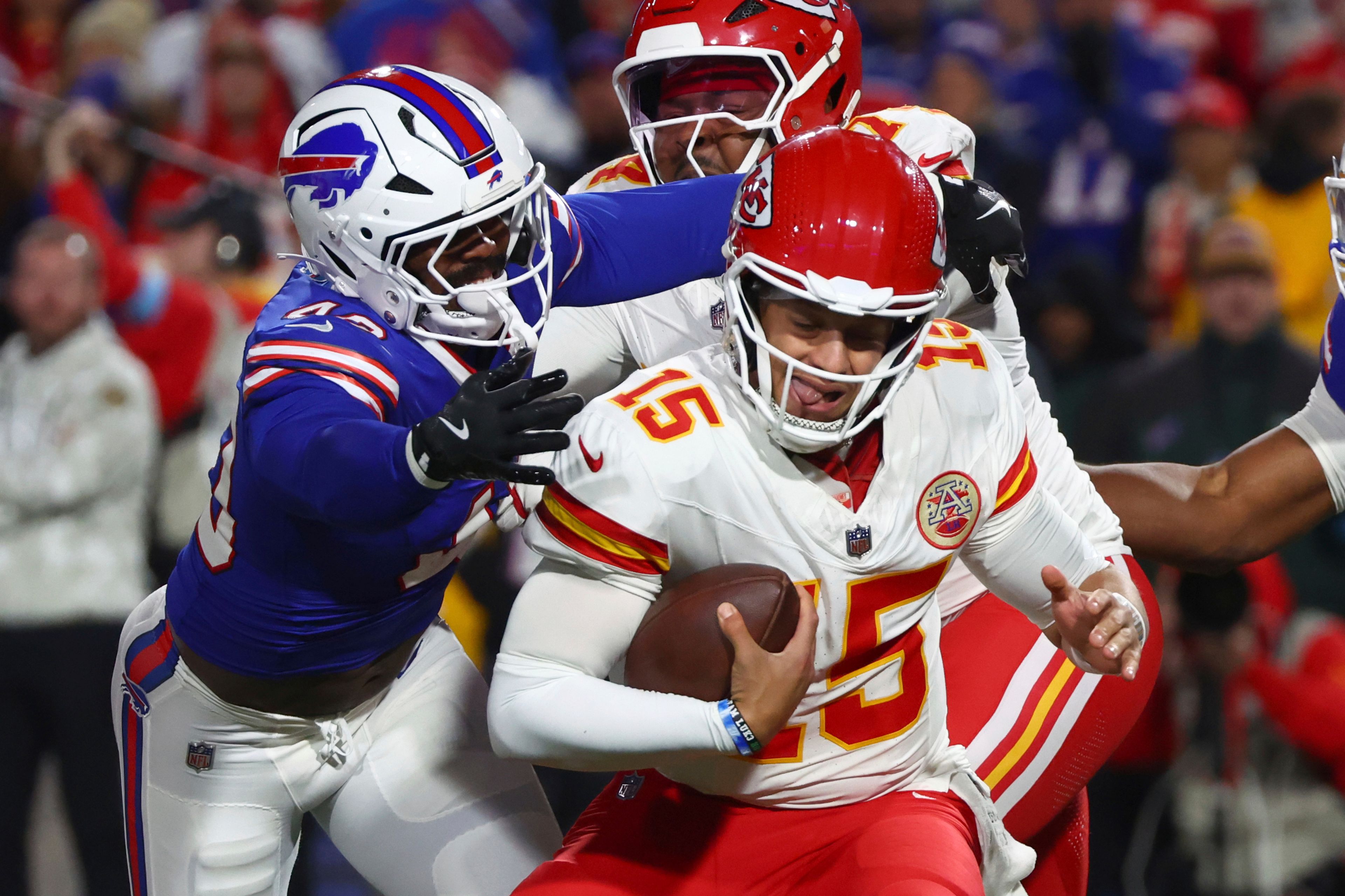 Kansas City Chiefs quarterback Patrick Mahomes (15) is pressured by Buffalo Bills linebacker Von Miller, left, during the first half of an NFL football game Sunday, Nov. 17, 2024, in Orchard Park, N.Y. (AP Photo/Jeffrey T. Barnes)