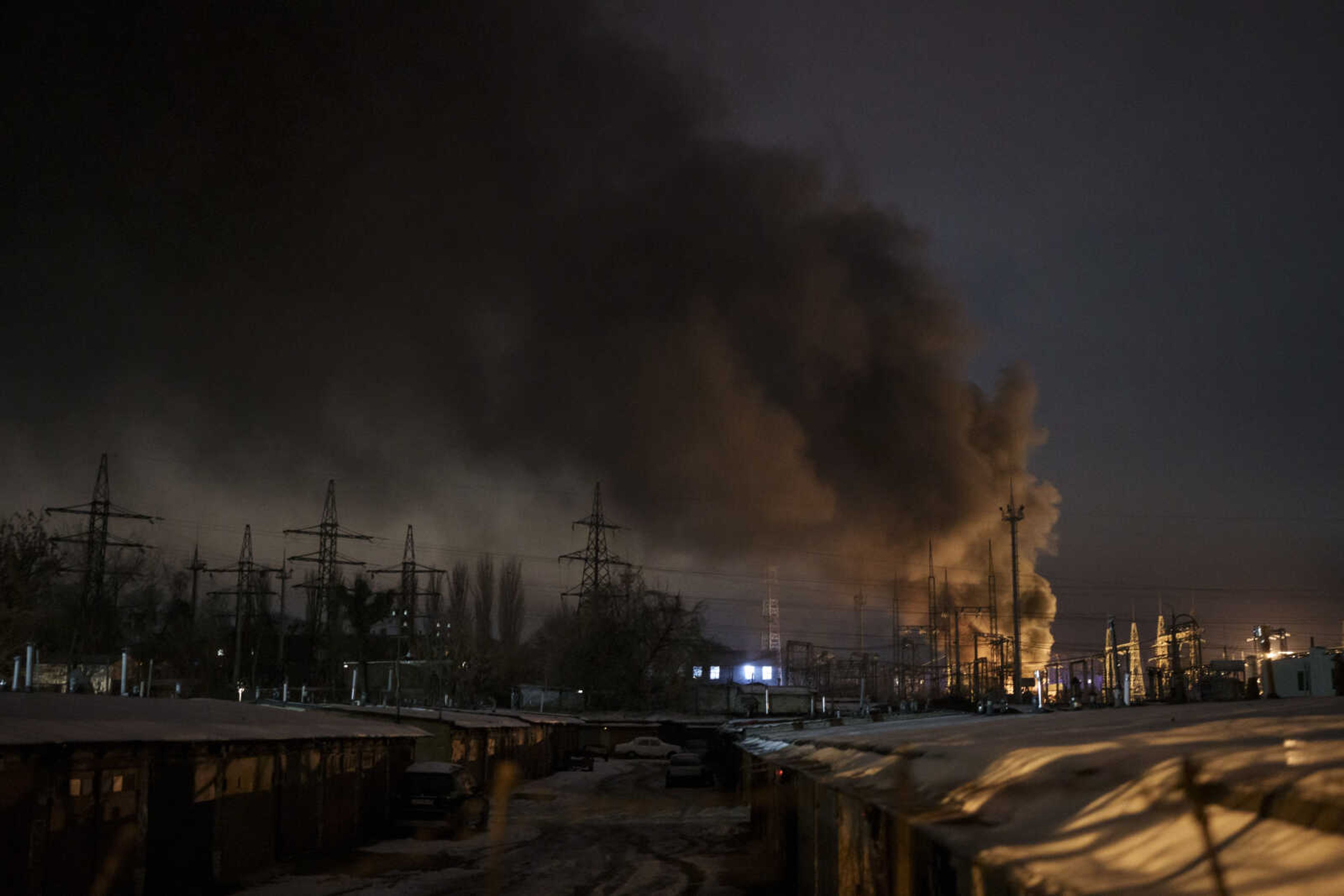 Smoke billows from a power infrastructure following a Russian drone attack Dec. 19 in Kyiv region, Ukraine. Ukraine has begun to export electricity once again, it was announced Tuesday.