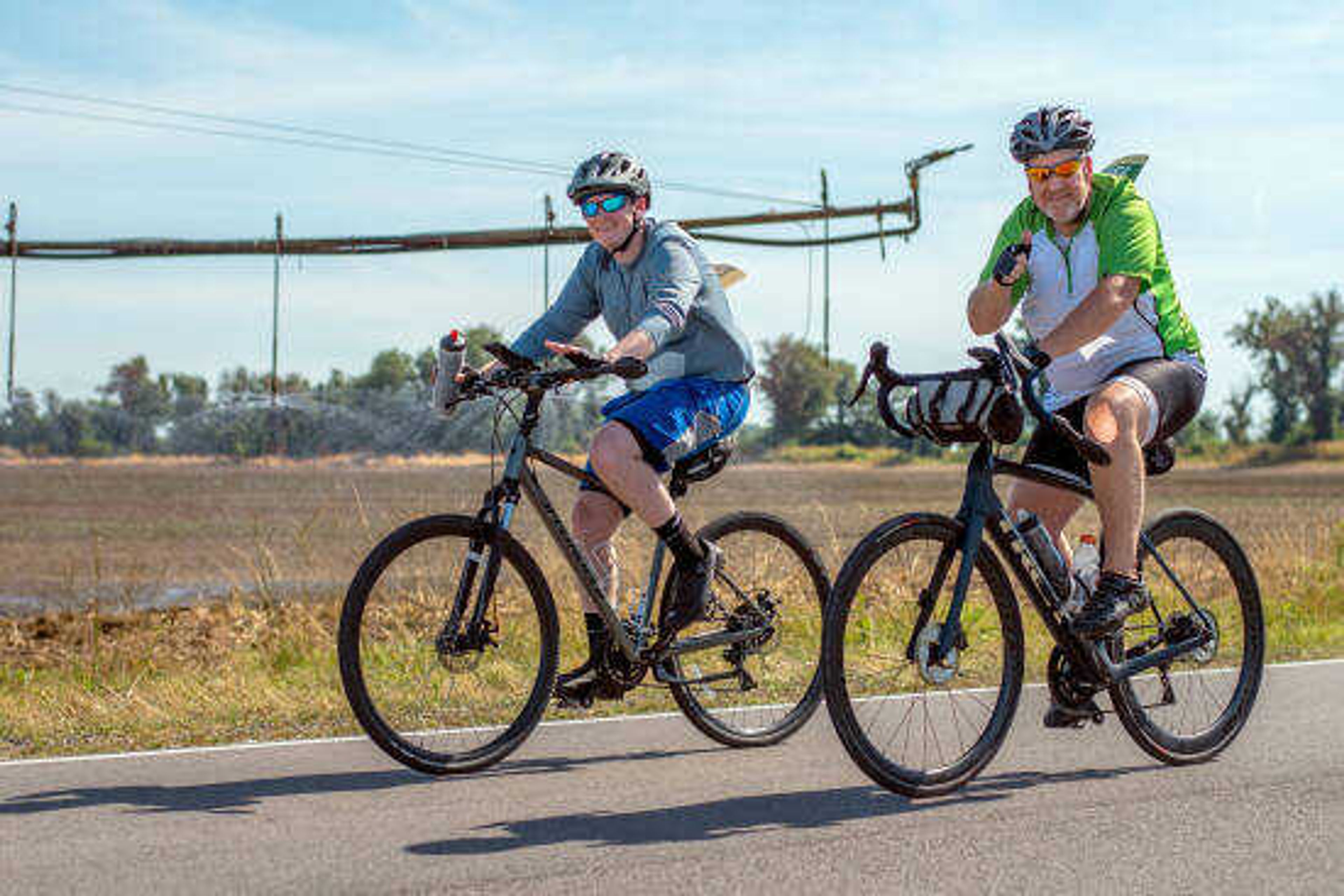 
Tour de Corn participants ride along the 33-mile route along farm roads and country highways outside East Prairie, Mo., Saturday, June 25, 2022.