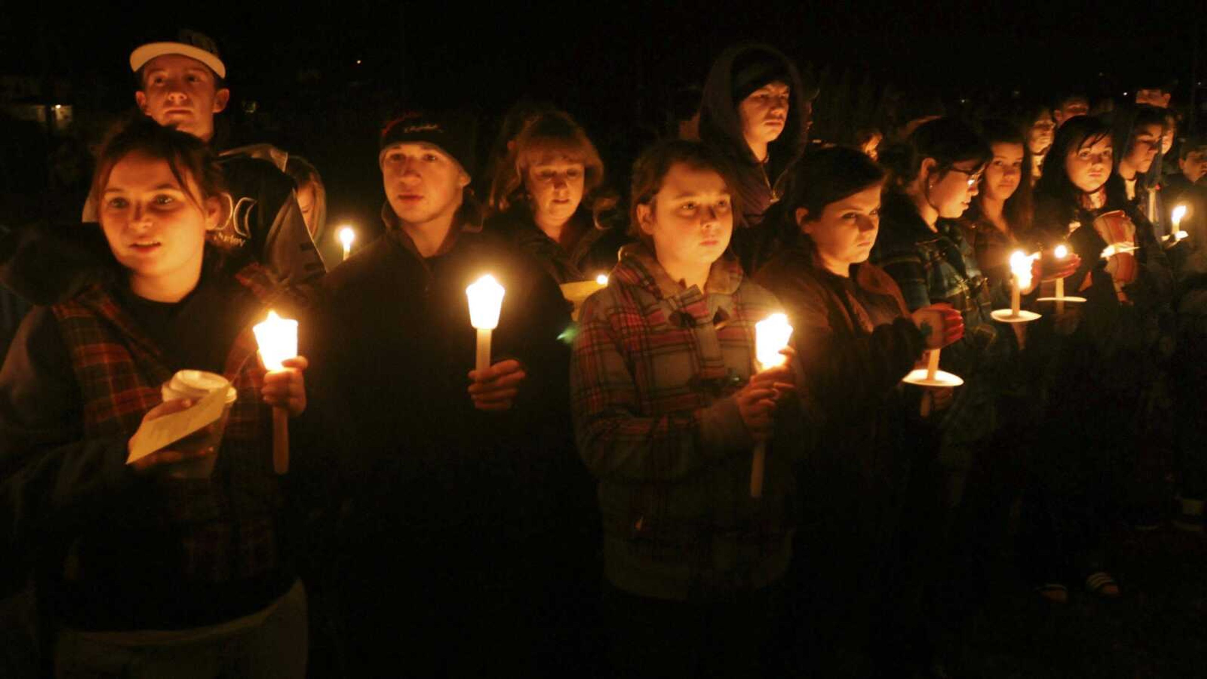 A candlelight vigil is held Jan. 15 at South Hadley, Mass., High School for freshman Phoebe Prince, 15, originally from Ireland. On Monday, nine teens were charged in the "unrelenting" bullying of Prince, who killed herself Jan. 14 after enduring months of torment by classmates in person and online. (DON TREEGER ~ The Republican)