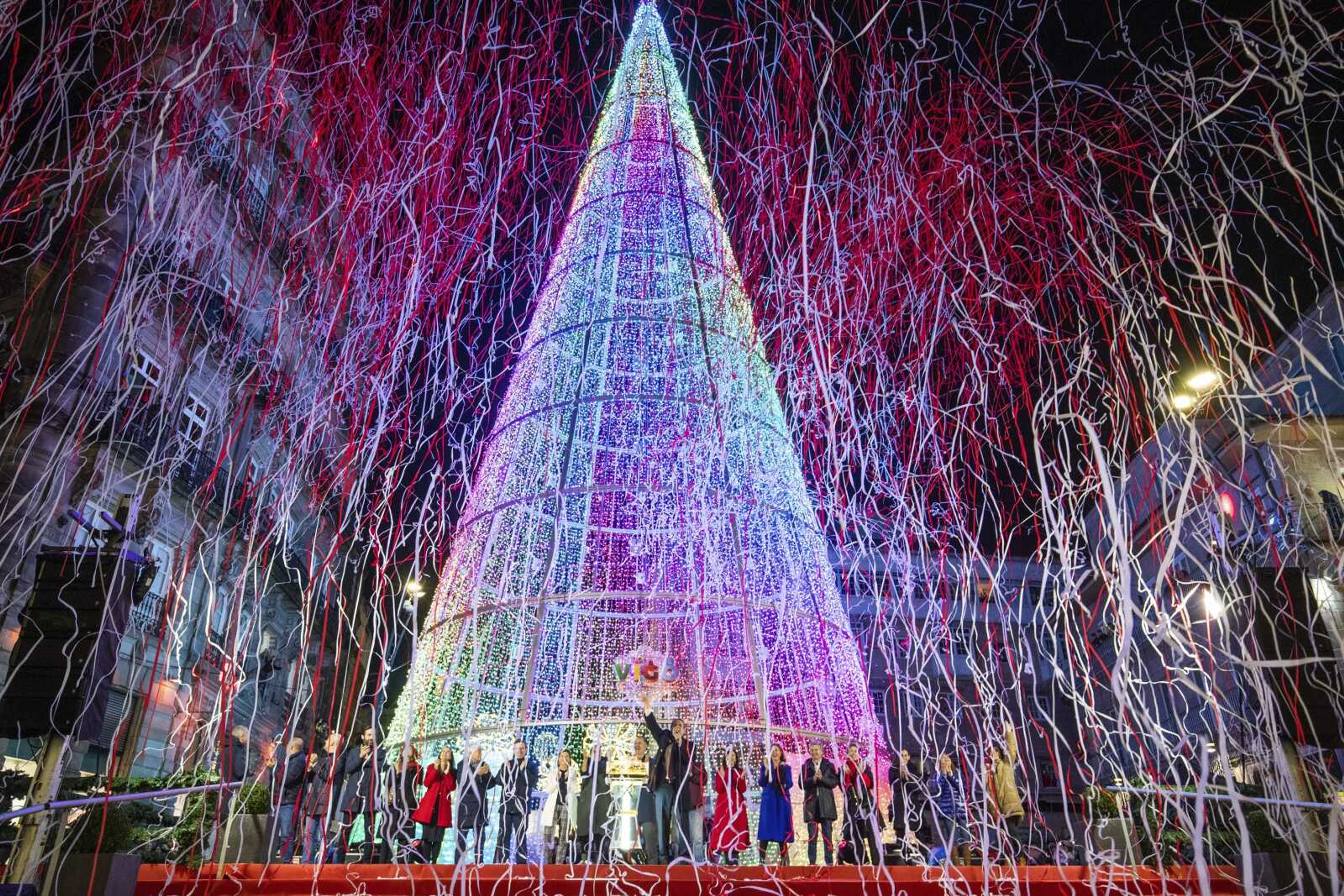 Local authorities inaugurate the Christmas lighting Nov. 19 in the streets of Vigo, Spain. In cities across Europe, officials are wrestling with a choice this Christmas. Dim lighting plans to send a message of energy conservation and solidarity with citizens squeezed by both higher energy costs and inflation or let the lights blaze in a message of defiance after two years of pandemic-suppressed Christmas seasons, creating a mood that retailers hope loosen holiday purses.