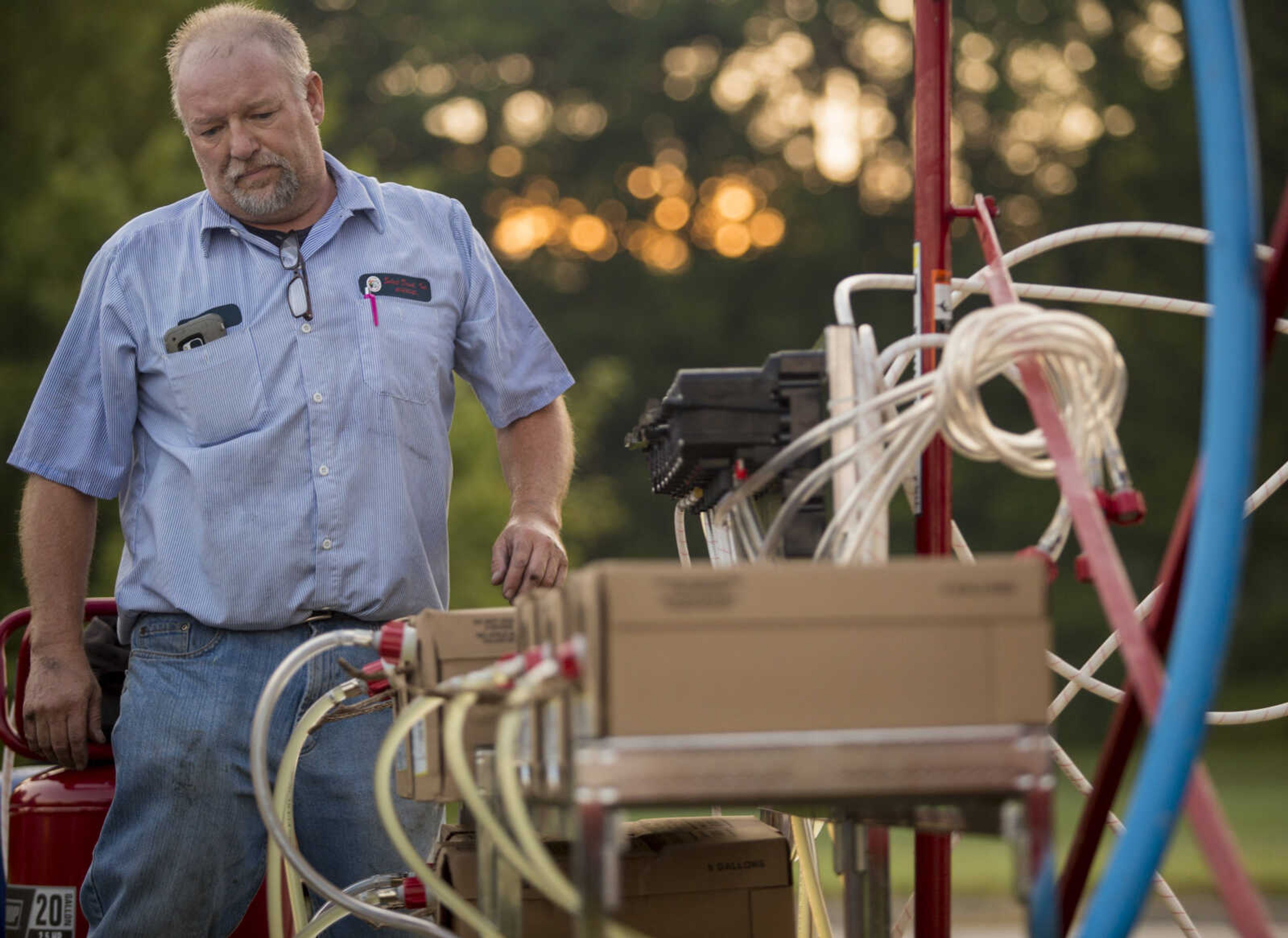 Jim Berns moves to switch an empty box of lemonade syrup outside of Mercato Di Rodi in Cape Girardeau early Sunday morning during an attempt to break the Guinness World Record for largest cup/glass of soft drink.