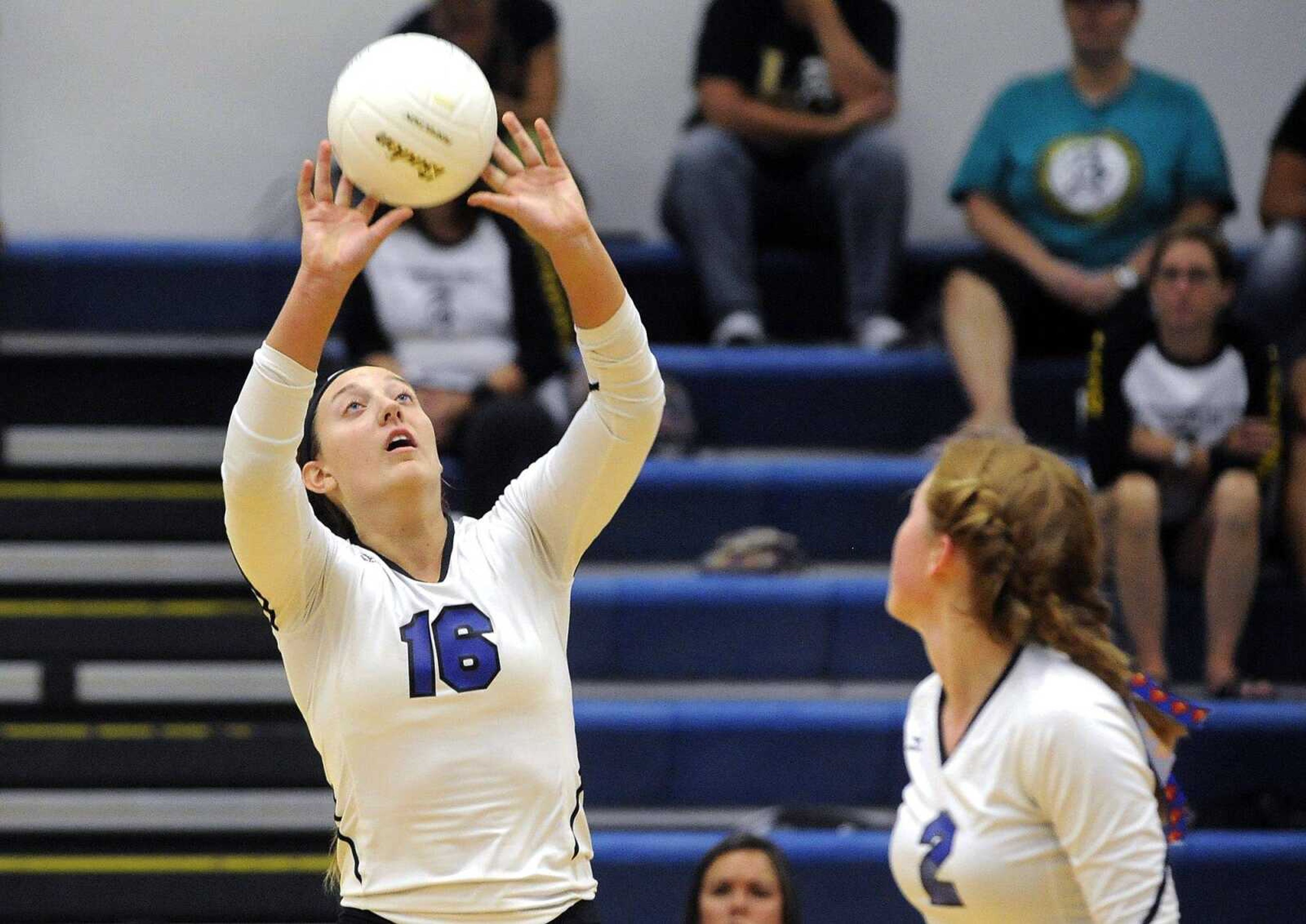 Notre Dame's Lexi Welter sets the ball for Maddie McClintock against Farmington during the second set Thursday, Aug. 25, 2016 at Notre Dame Regional High School.