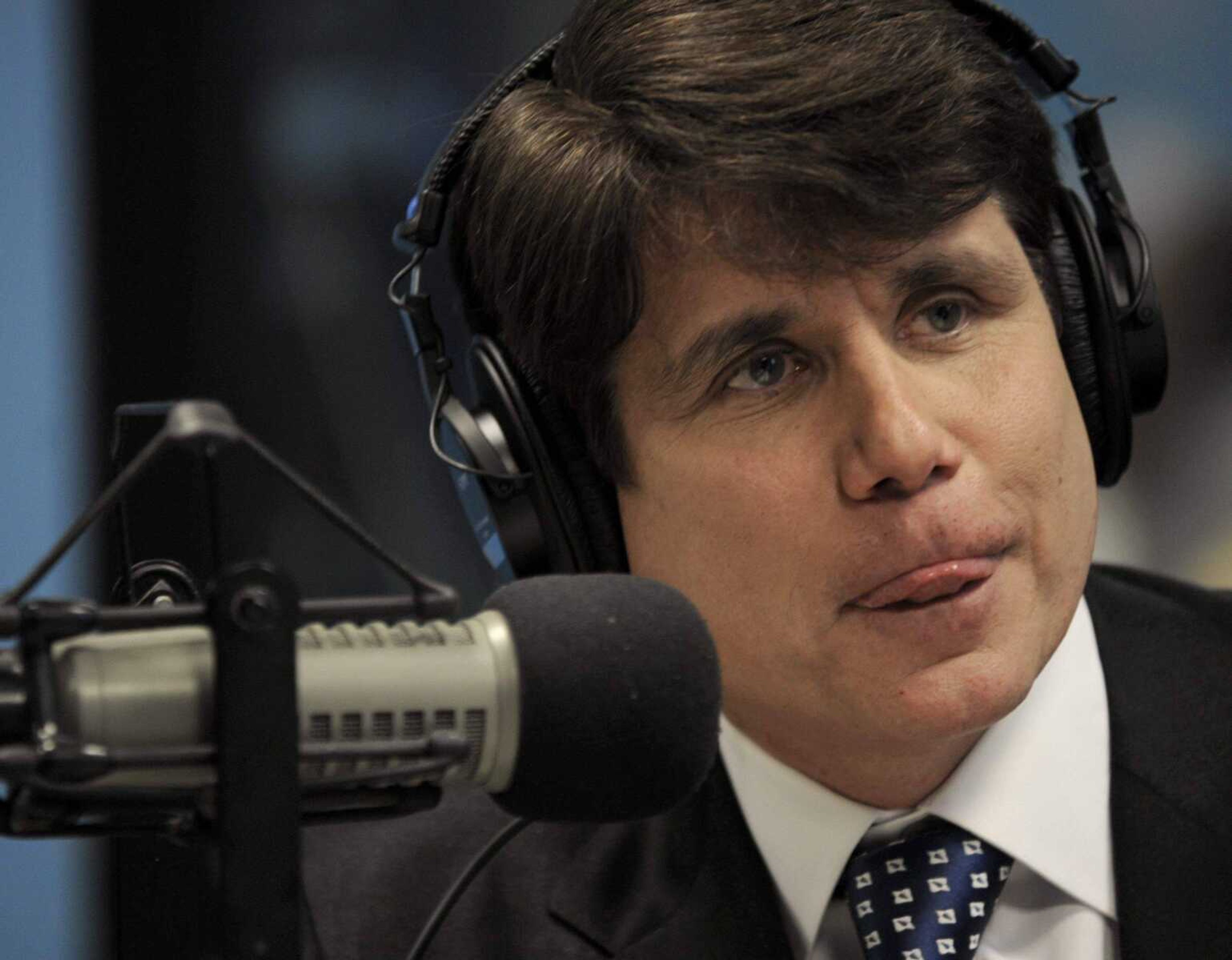 Paul Beaty ~ Associated Press<br>Illinois Gov. Rod Blagojevich listens to a caller while on the air with radio talk show host Cliff Kelly Friday at WVON radio station in Chicago.