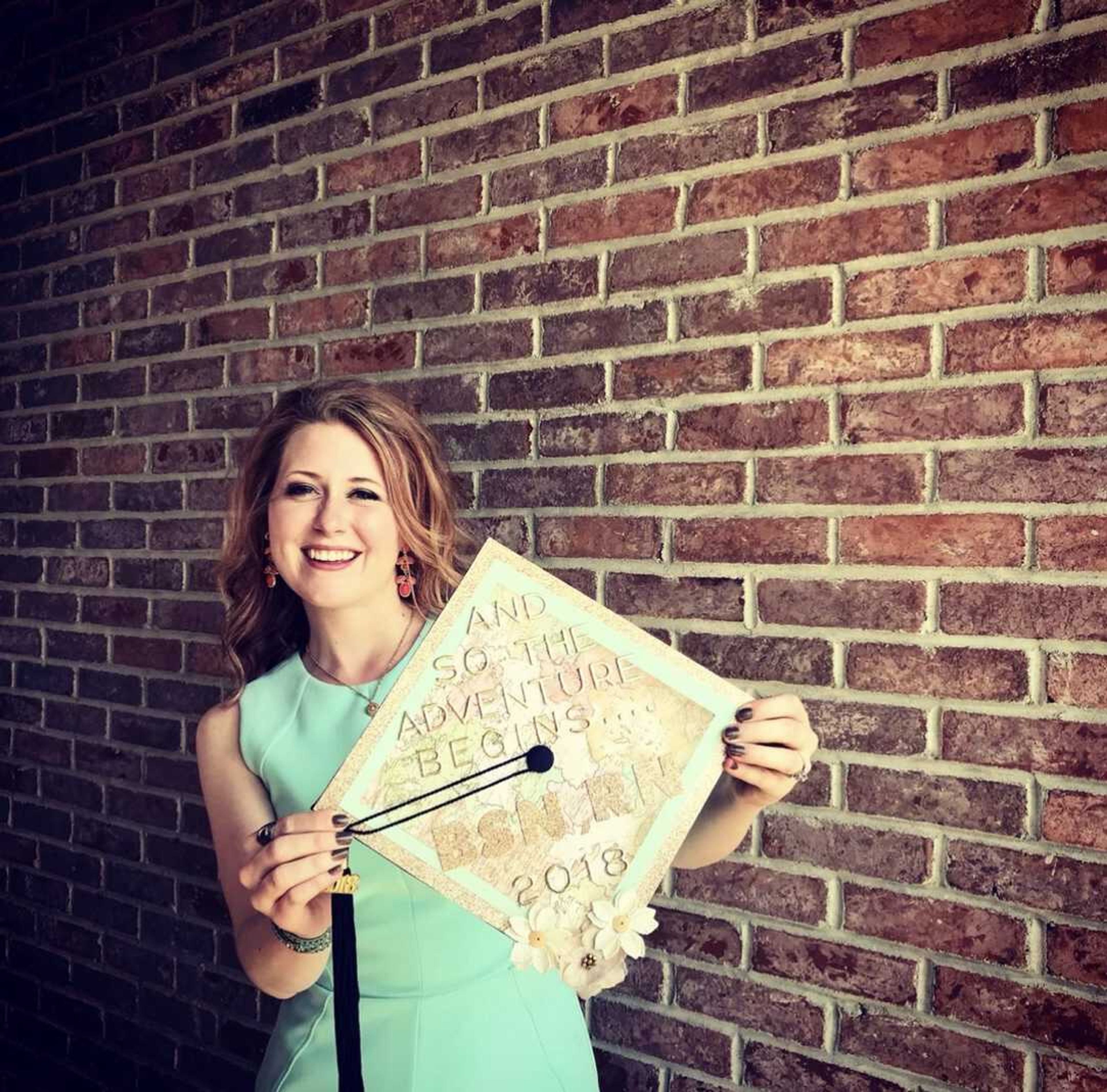 Alyssa Kozlovsky poses with her graduation cap for graduating from Southeast Missouri State University with a nursing degree. Kozlovsky will soon celebrate her five-year work anniversary at Saint Francis Medical Center in Cape Girardeau.