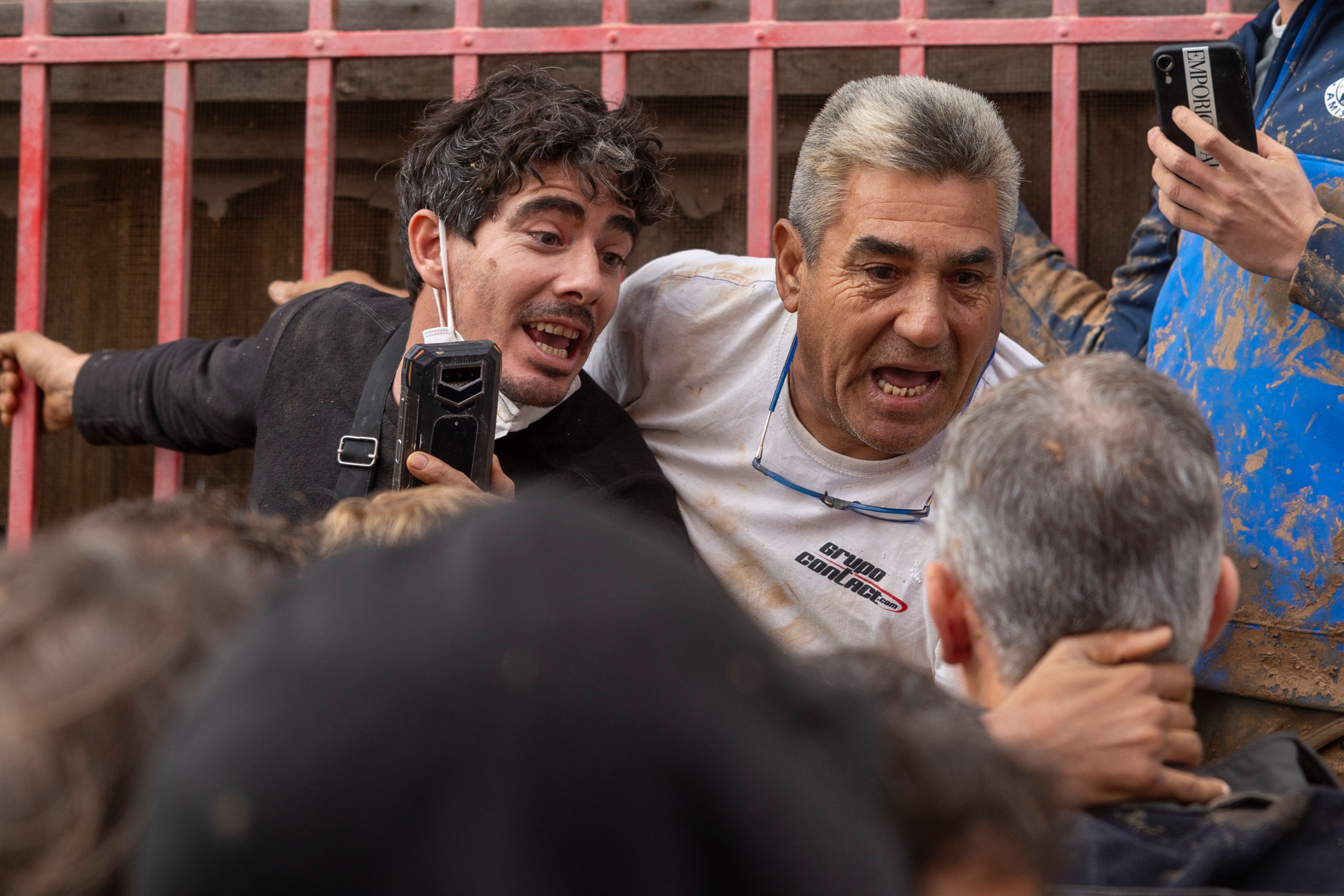 Spain's King Felipe VI speaks with people amidst angry Spanish flood survivors in Paiporta, near Valencia, Spain, Sunday Nov. 3, 2024. (AP Photo/David Melero)