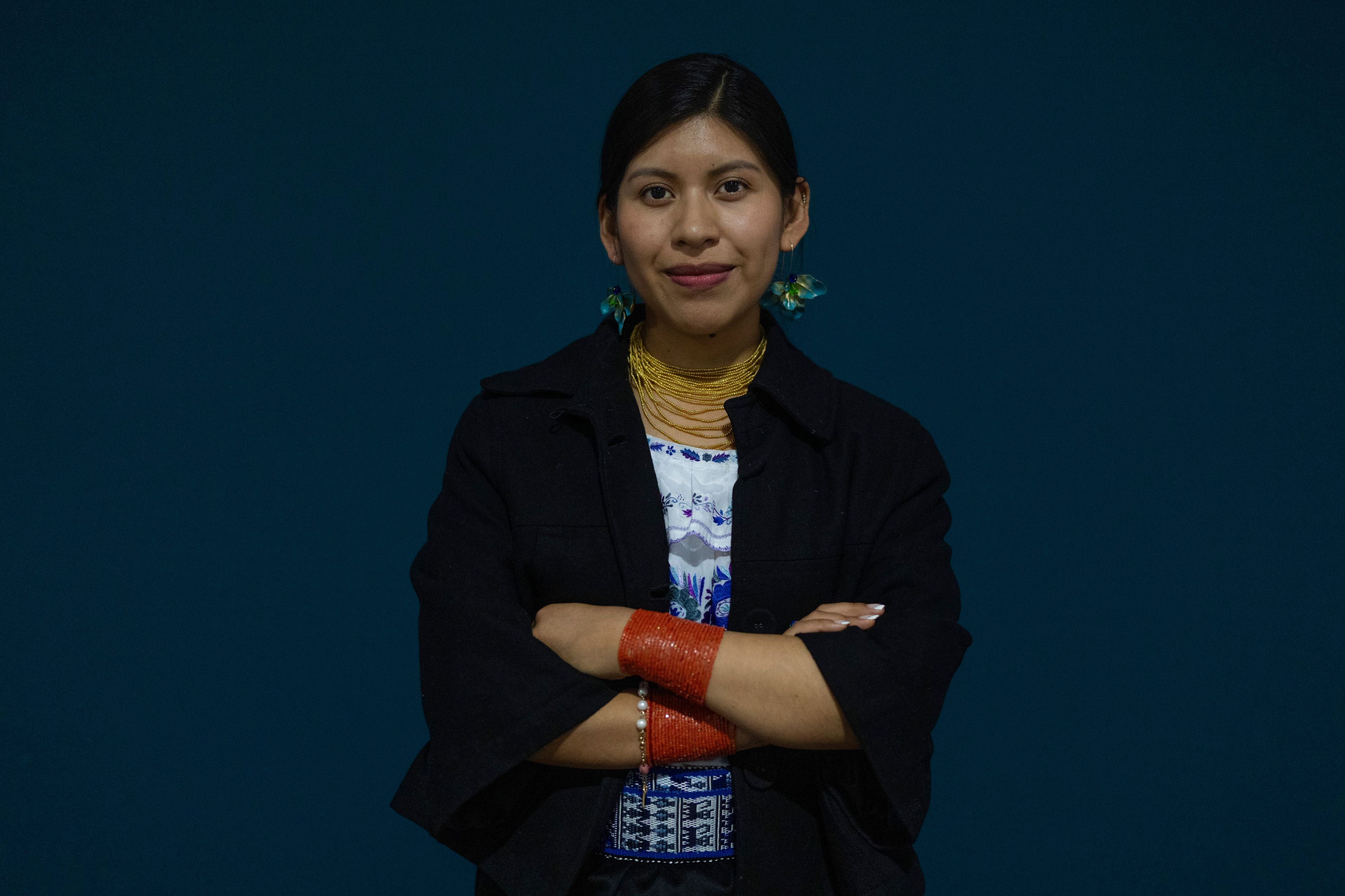 Sydney Males, 27, of Otavalo, Ecuador, from the Kichwa Otavalo community, poses for a photo during the COP29 U.N. Climate Summit, Thursday, Nov. 14, 2024, in Baku, Azerbaijan.(AP Photo /Rafiq Maqbool)