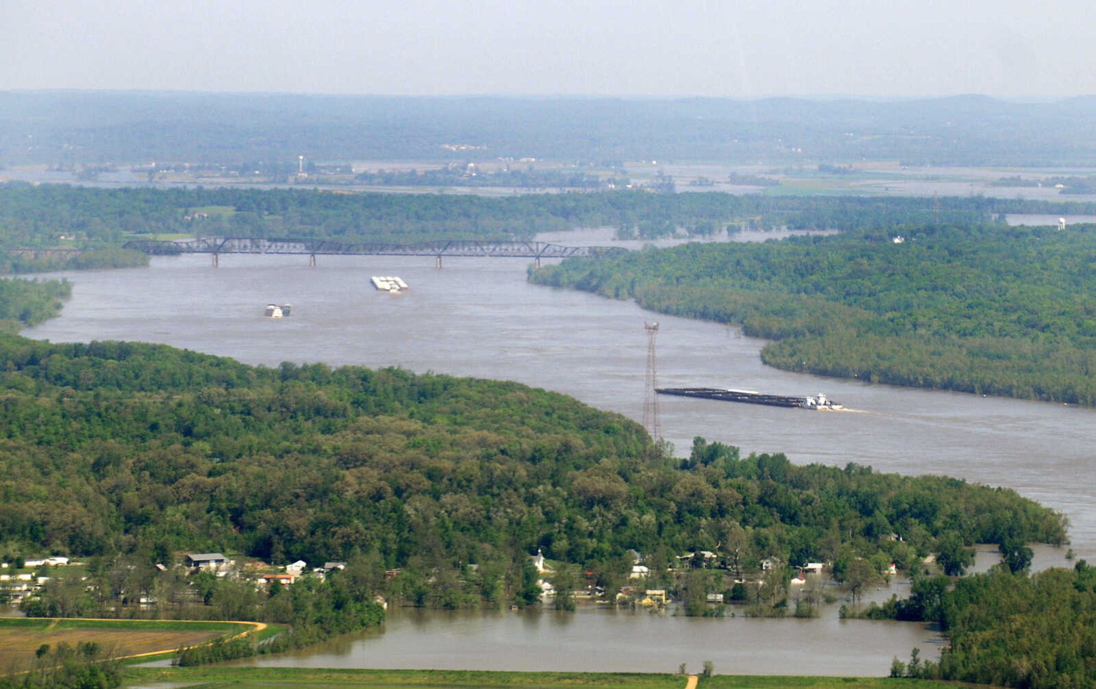 KRISTIN EBERTS ~ keberts@semissourian.com

Barges travel north on the Mississippi River toward Scott City, Mo., on Thursday, April 28, 2011.