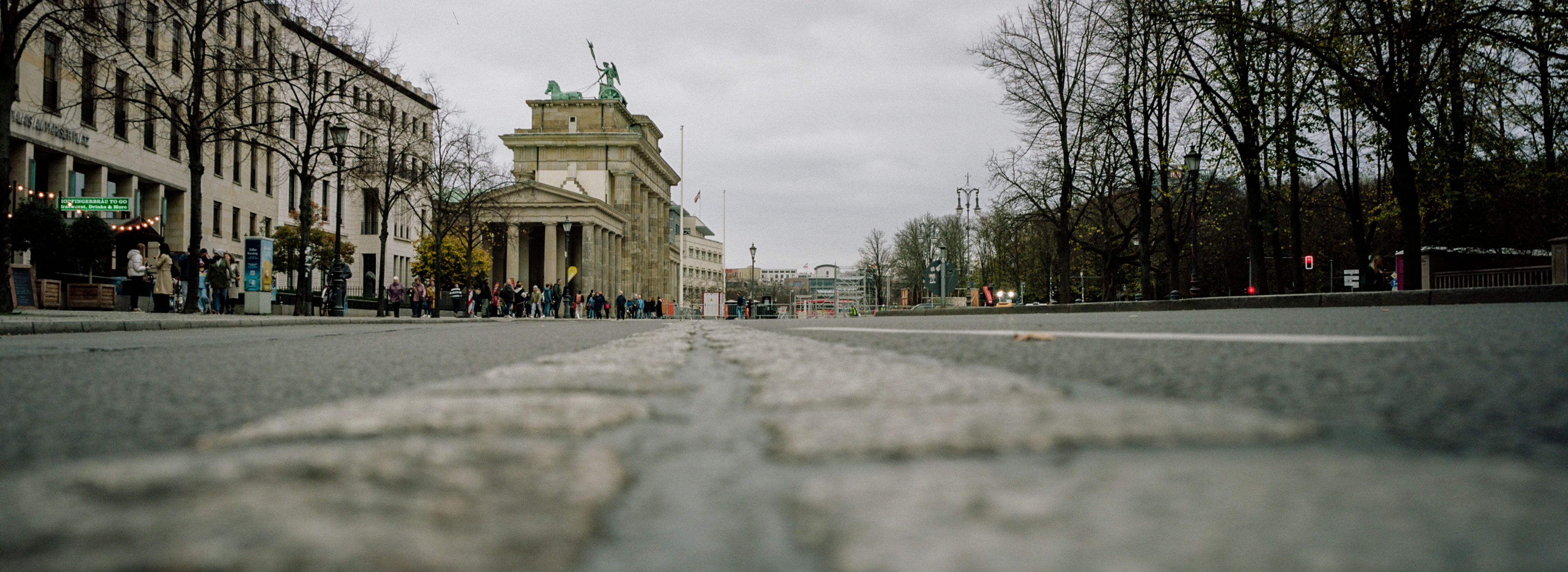 Stones on the street mark the course of the former Berlin Wall near the Brandenburg Gate in Berlin, Monday, Nov. 4, 2024. (AP Photo/Markus Schreiber)