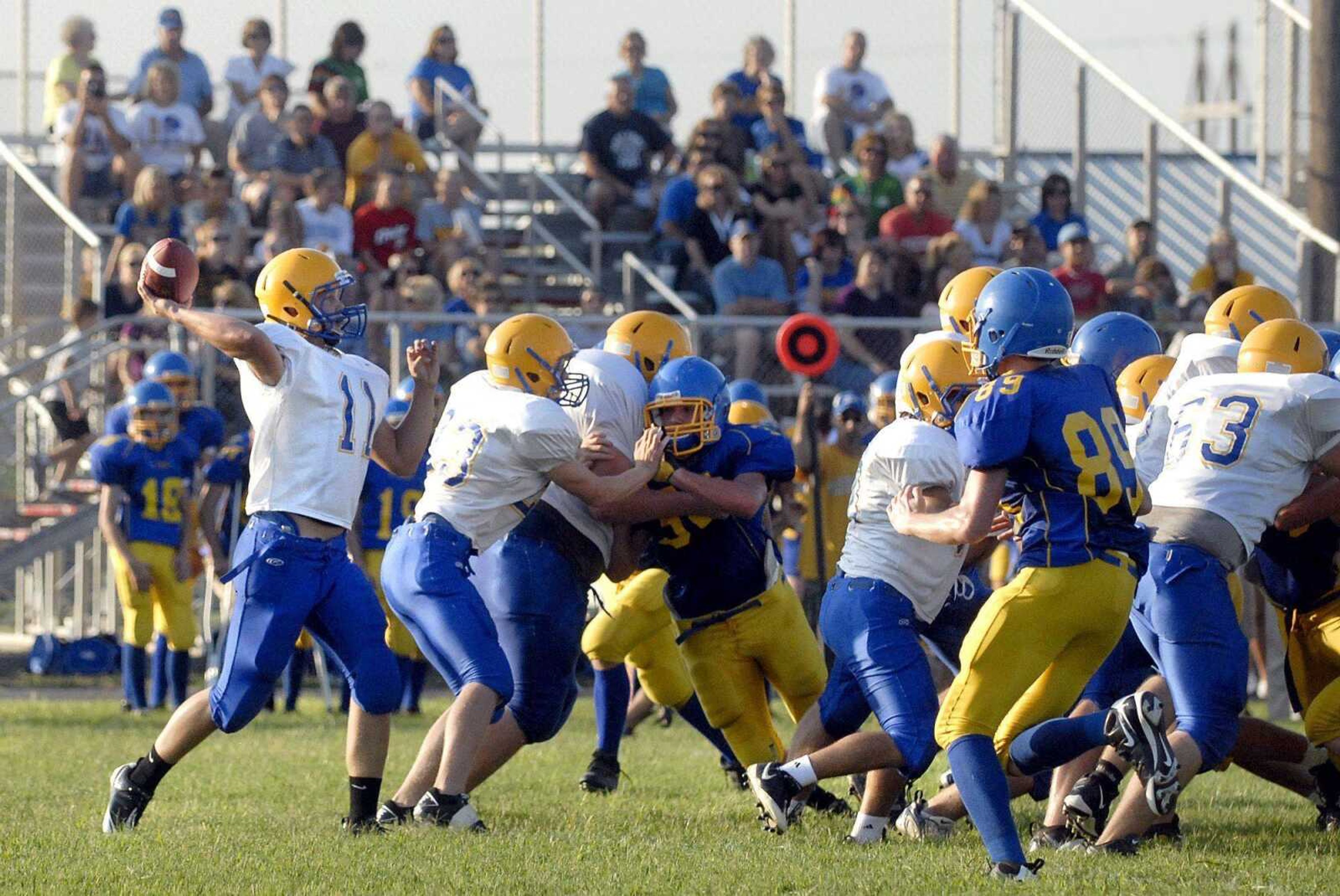 Scott City quarterback Jonathan McFall passes against St. Vincent during the three-team jamboree Friday in Scott City . (Laura Simon)