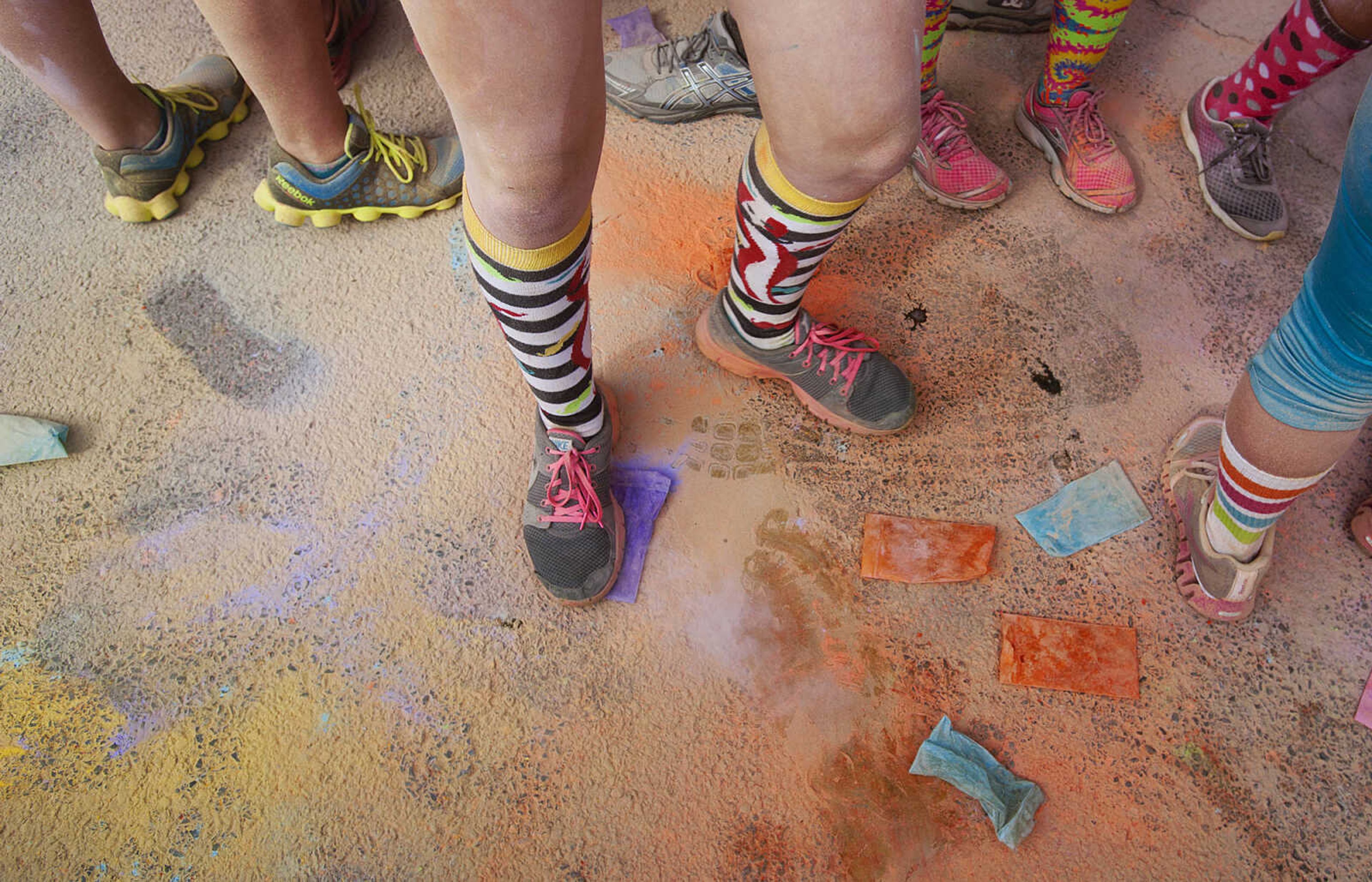 ADAM VOGLER ~ avogler@semissourian.com
Colored powers coats the street in front of the Bell Air Grill after the participants in the Color Me Cape 5k did the first color bomb Saturday, April 12, in Cape Girardeau.