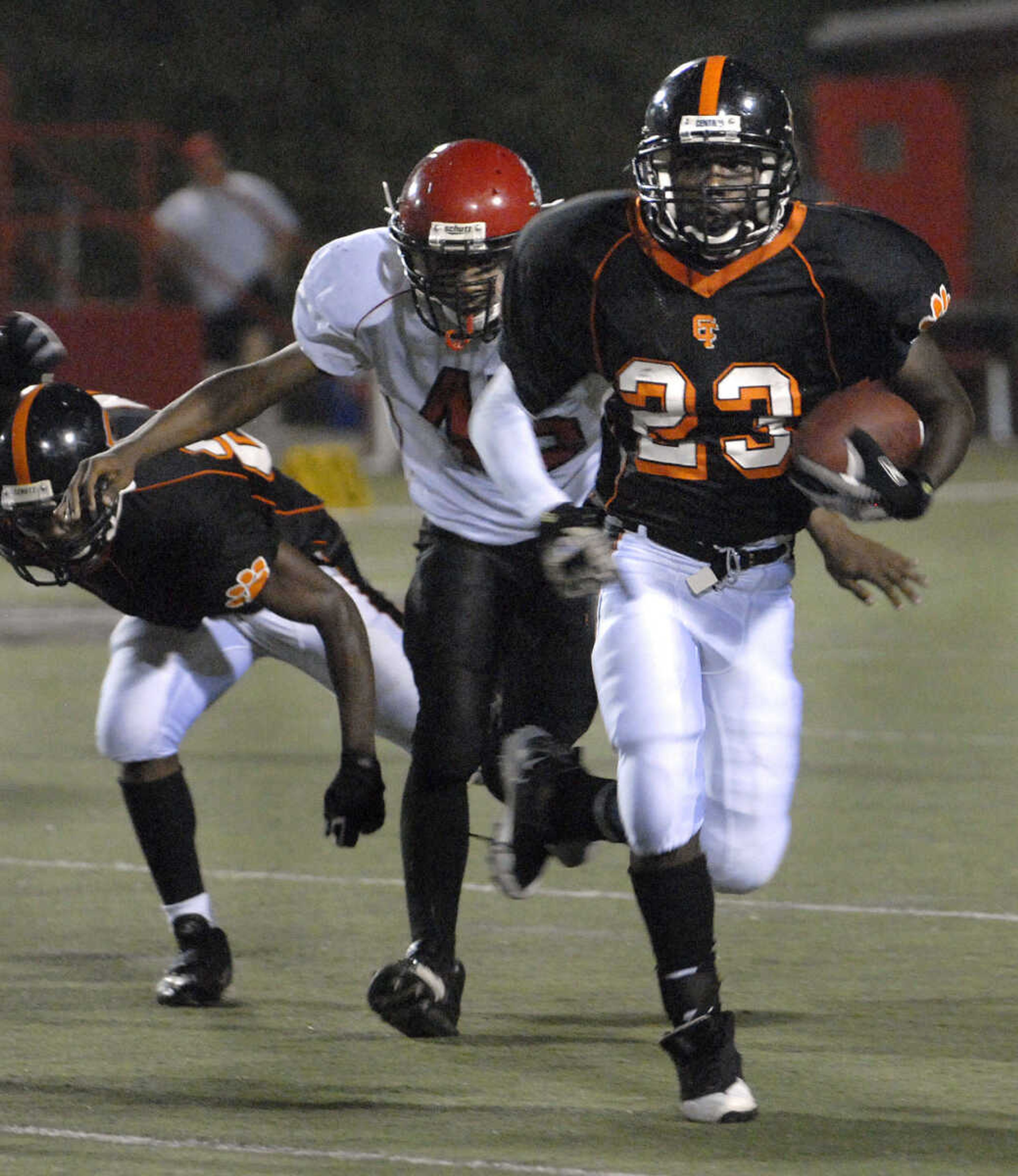 FRED LYNCH ~ flynch@semissourian.com
Central's Tae Jenkins carries the ball away from Sikeston's Kyle Valentine during the second quarter Thursday at Houck Stadium.