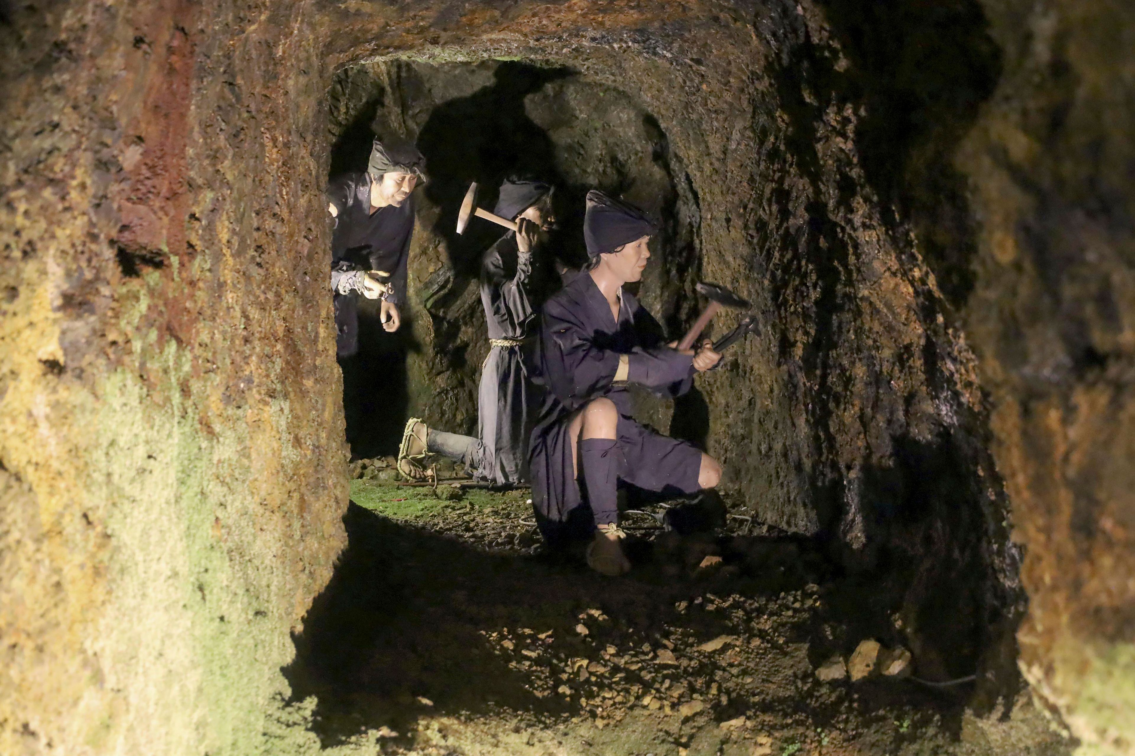 Mannequins enacting a mining scene are seen inside remains of the Sado gold mine on Sado Island, northern Japan, on July 4, 2024. (Atsushi Watanabe/Kyodo News via AP)