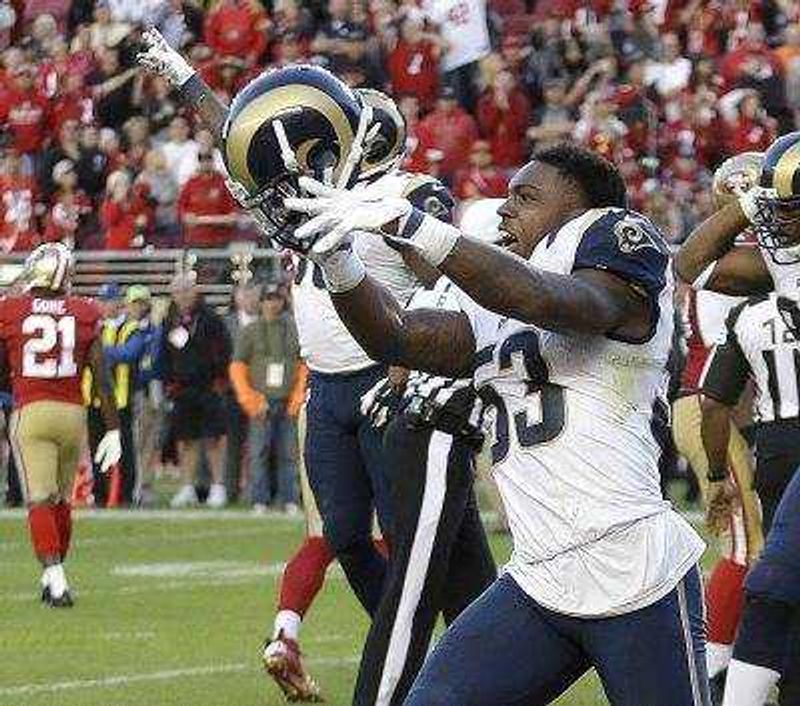 Rams linebacker Daren Bates celebrates after the Rams recovered a fumble by 49ers quarterback Colin Kaepernick during the fourth quarter Sunday.