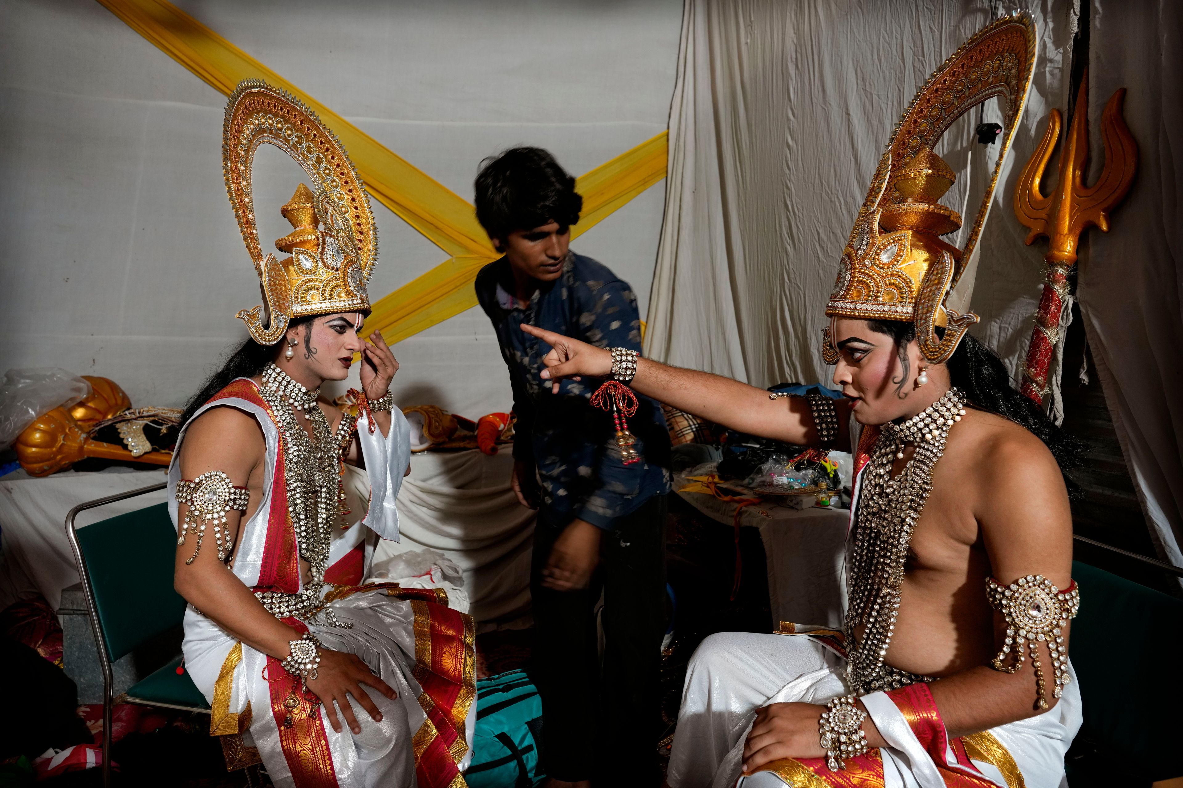 Ashutosh Agnihotri, 23, right, playing the character of Hindu god Rama, rehearses his lines backstage before the start of Ramleela, a dramatic folk re-enactment of the life of Rama according to the ancient Hindu epic Ramayana, in New Delhi, India, Saturday, Oct. 5, 2024. (AP Photo/Manish Swarup)