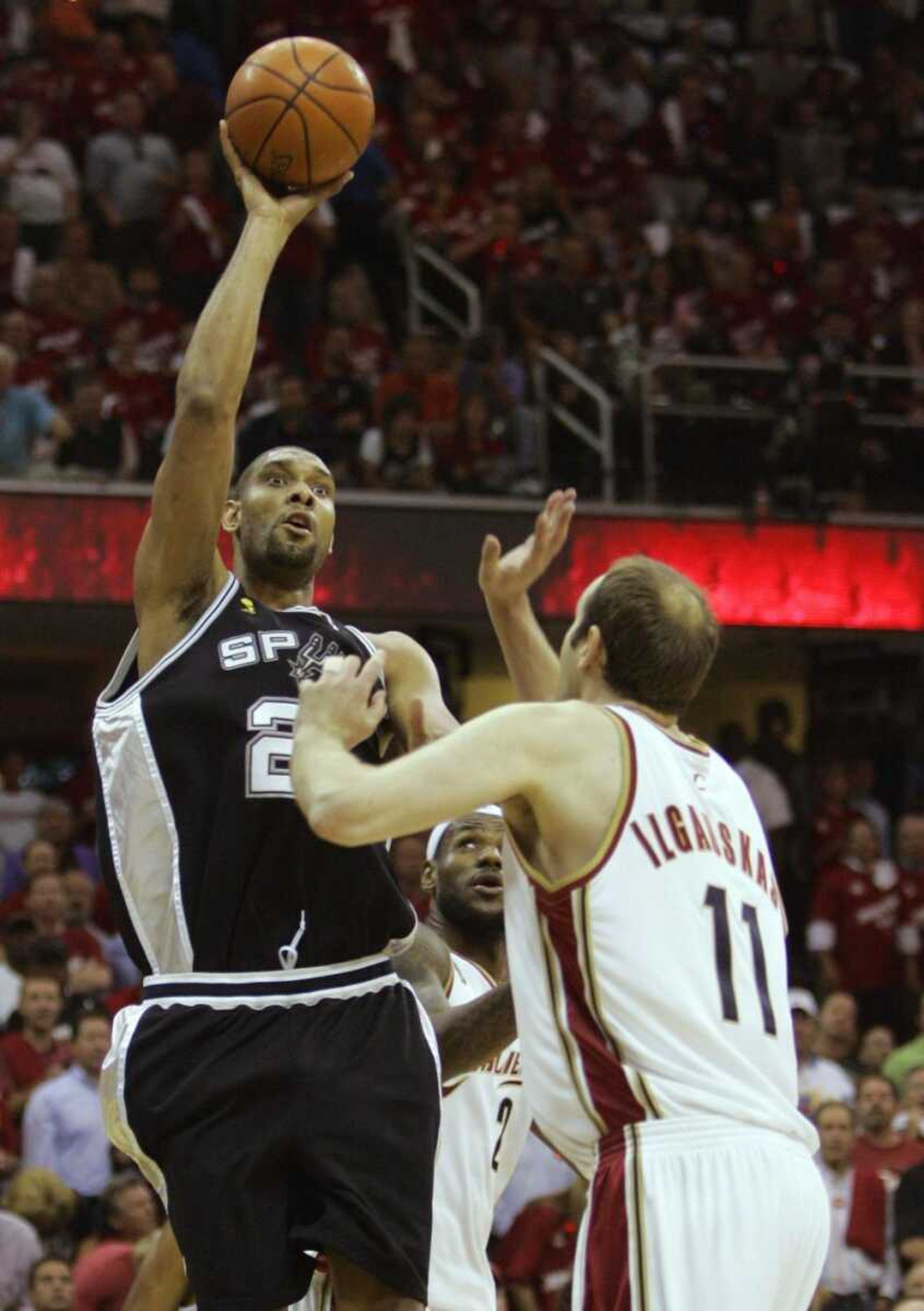 San Antonio's Tim Duncan shot over Cleveland's Zydrunas Ilgauskas during Tuesday's game in Cleveland. (Eric Gay ~ Associated Press)