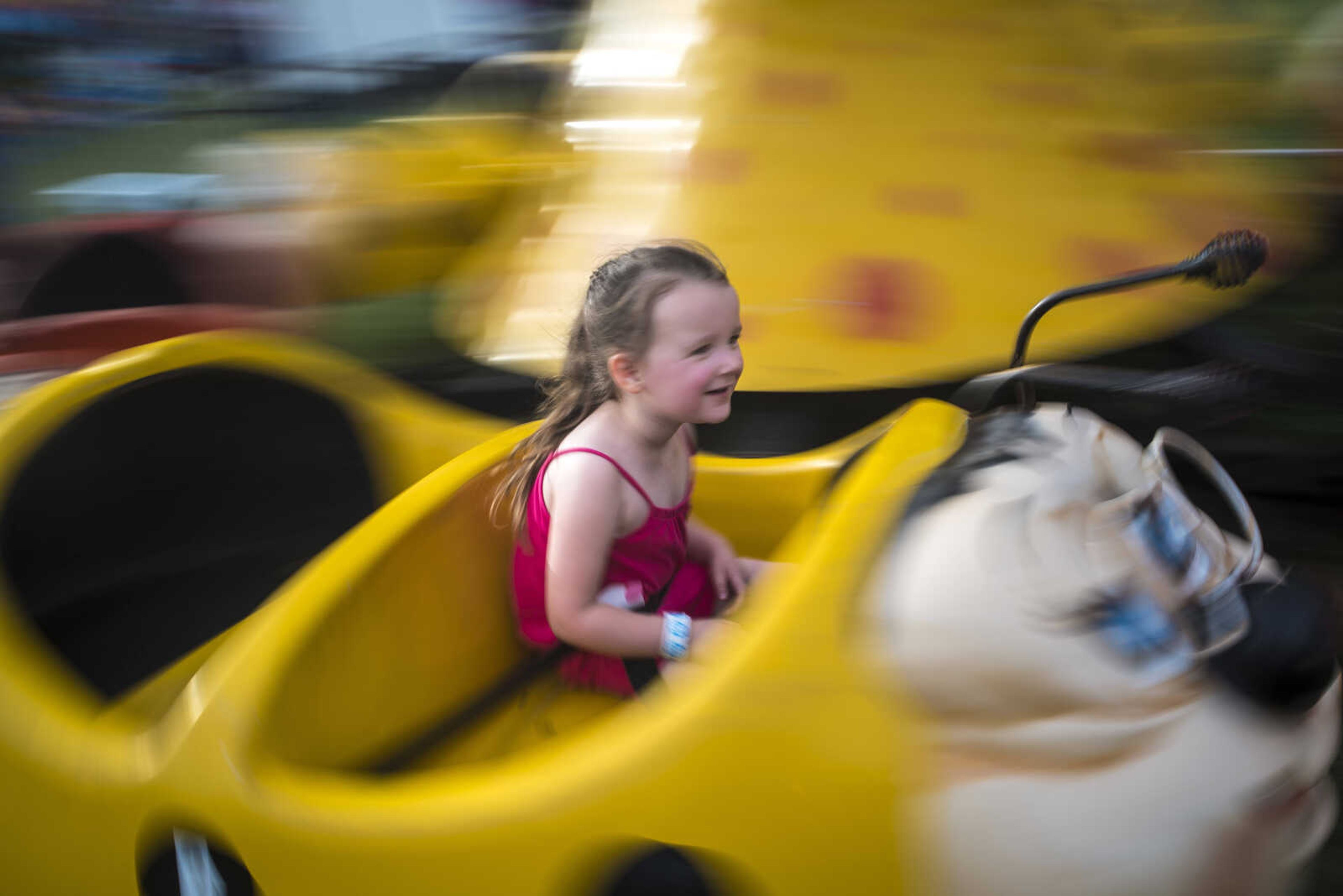 "Best ride ever!" Addison McFall, 3, yells out during the 41st annual Mid-Summer Festival Friday, June 16, 2017 at Scott City Park.