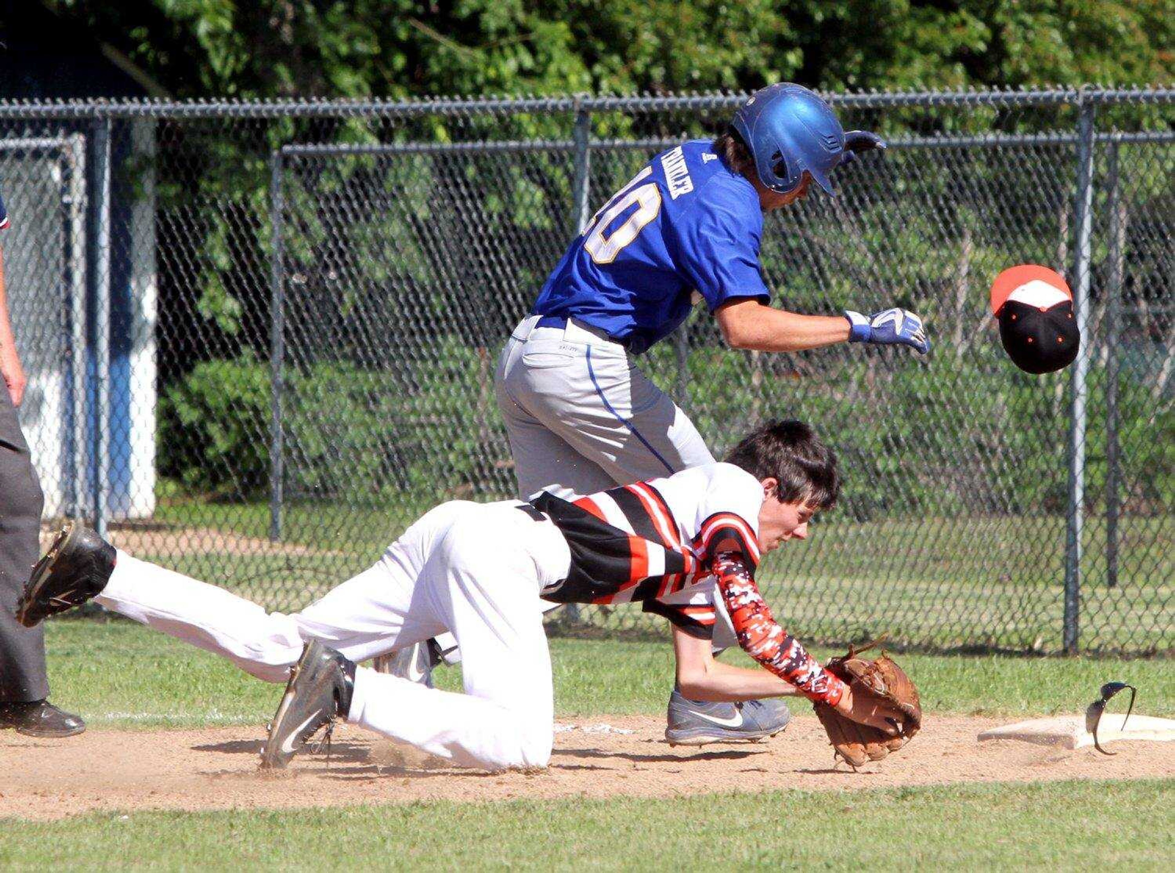 Oran's Thomas Trankler collides with Advance's Cade Long while being tagged out during a rundown on Tuesday in a Class 1 District 2 semifinal game in Oran, Missouri. (David Jenkins ~ Standard Democrat)