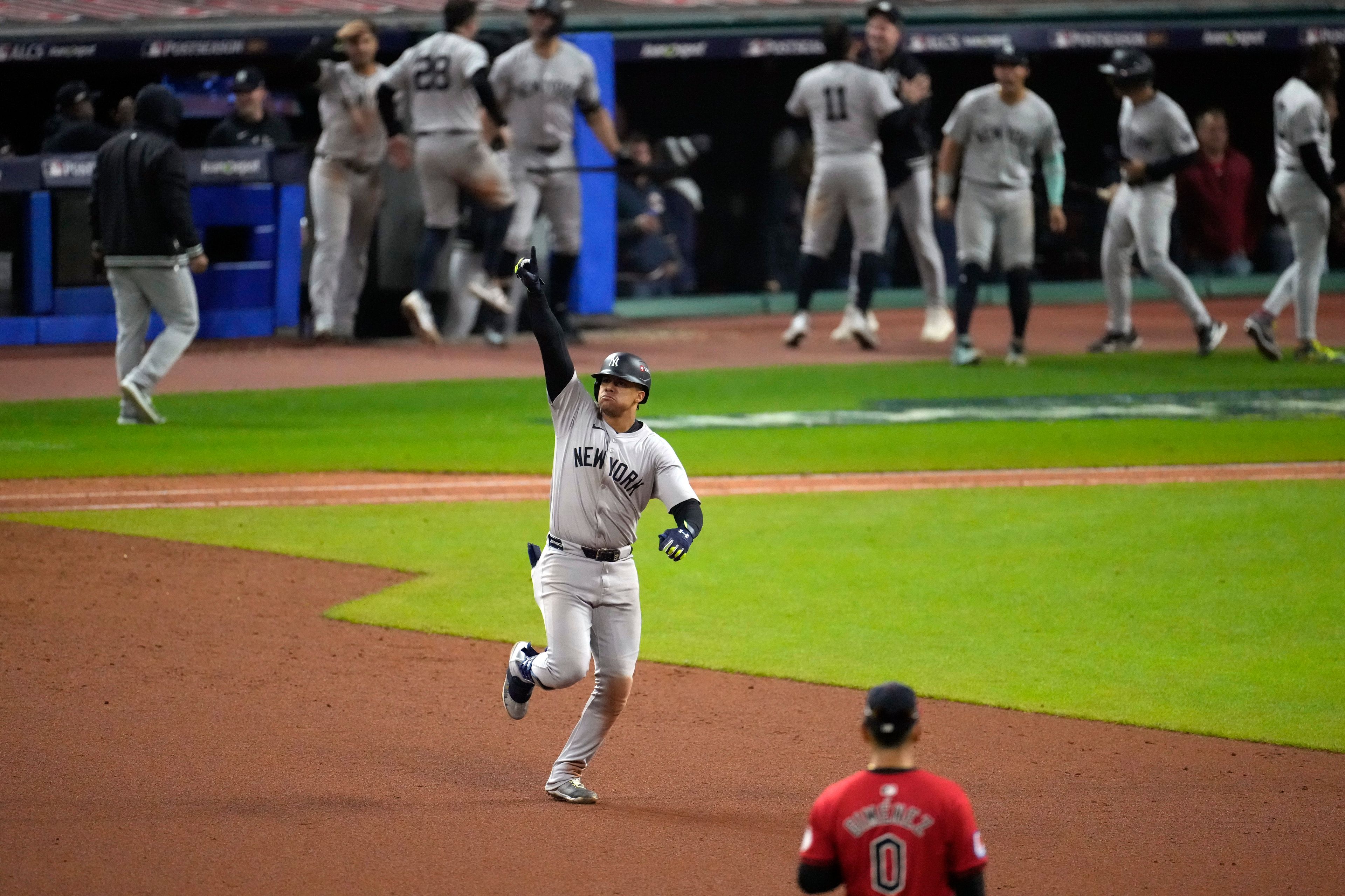 New York Yankees' Juan Soto celebrates after hitting a three-run home run against the Cleveland Guardians during the 10th inning in Game 5 of the baseball AL Championship Series Saturday, Oct. 19, 2024, in Cleveland. (AP Photo/Jeff Roberson)