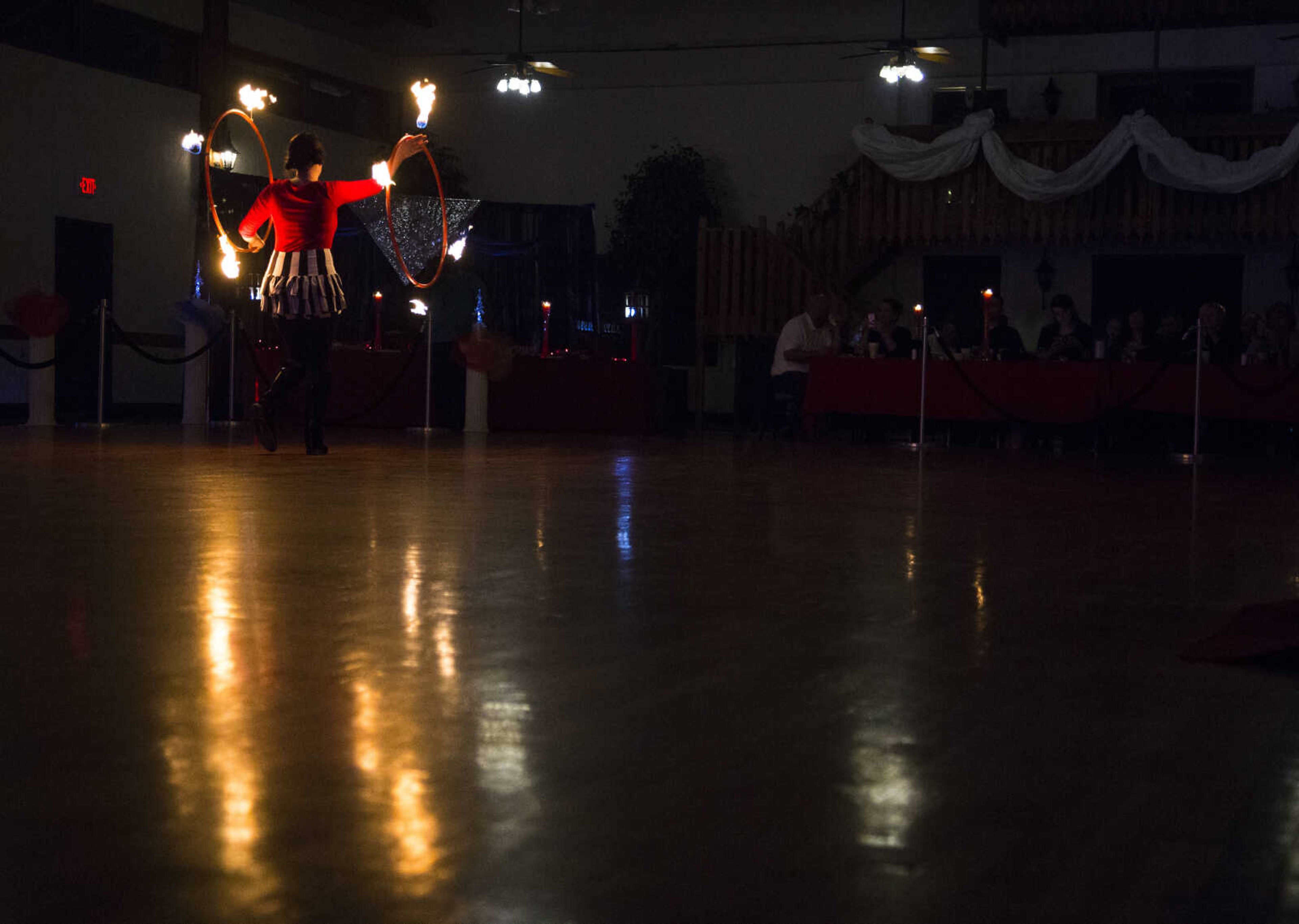 Holly Nothaker moves across the floor while fire dancing Saturday, Feb. 3, 2018, during the Fire and Ice Gala at Bavarian Halle in Jackson.