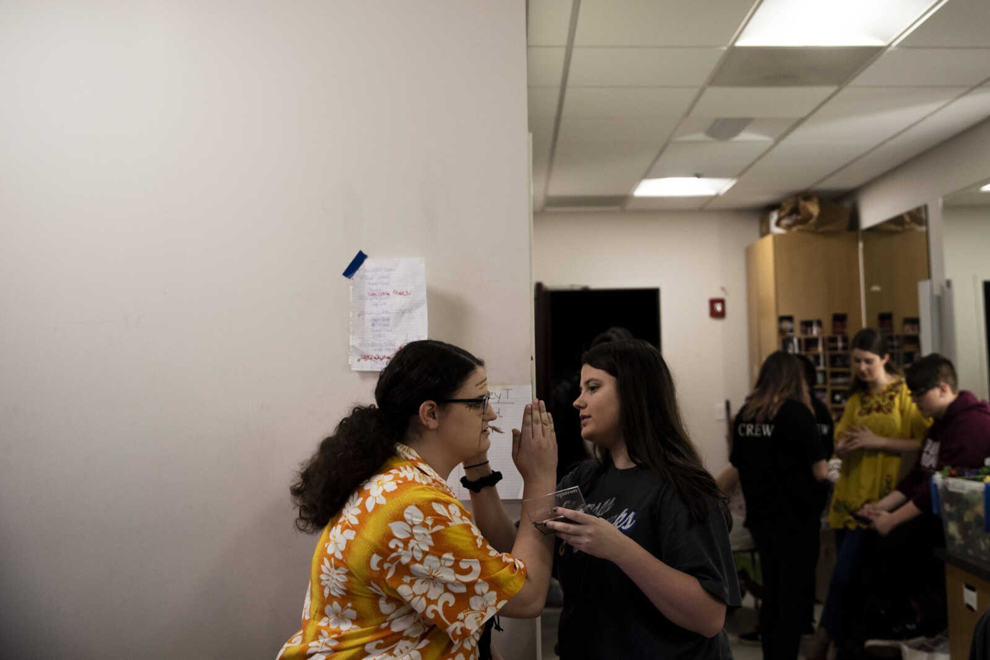 Elizabeth Hughes, left, touches up character makeup for Grace Goeckeler, portraying Rosie Mulligan, during the media night of Cape Central High School's spring musical production of "Mamma Mia!" Wednesday, April 10, 2019, in Cape Girardeau.