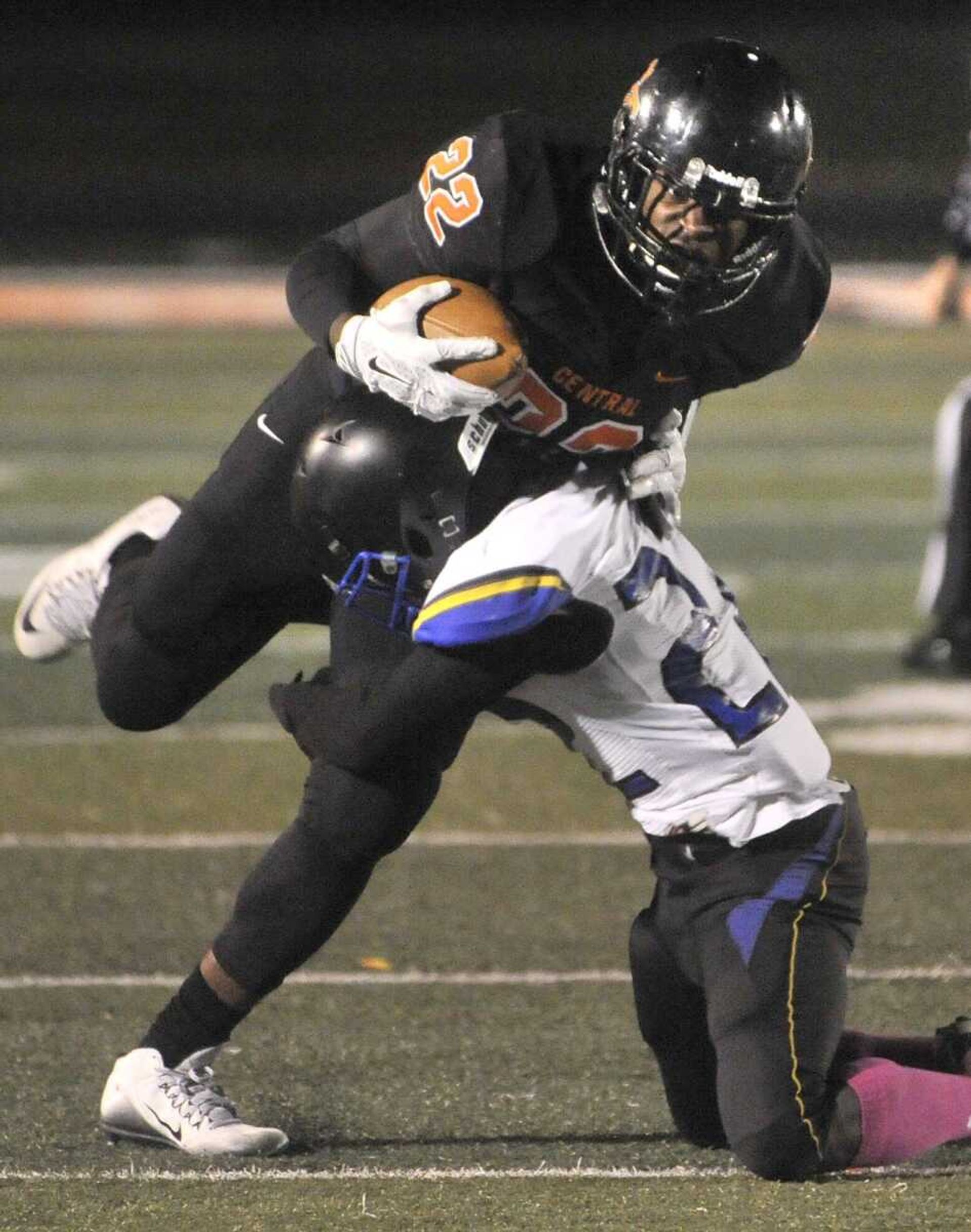 Cape Central's Aaron Harris carries before a tackle by Riverview Gardens' Davion Evers during the first quarter Friday, Oct. 16, 2015 at Cape Central High School. (Fred Lynch)