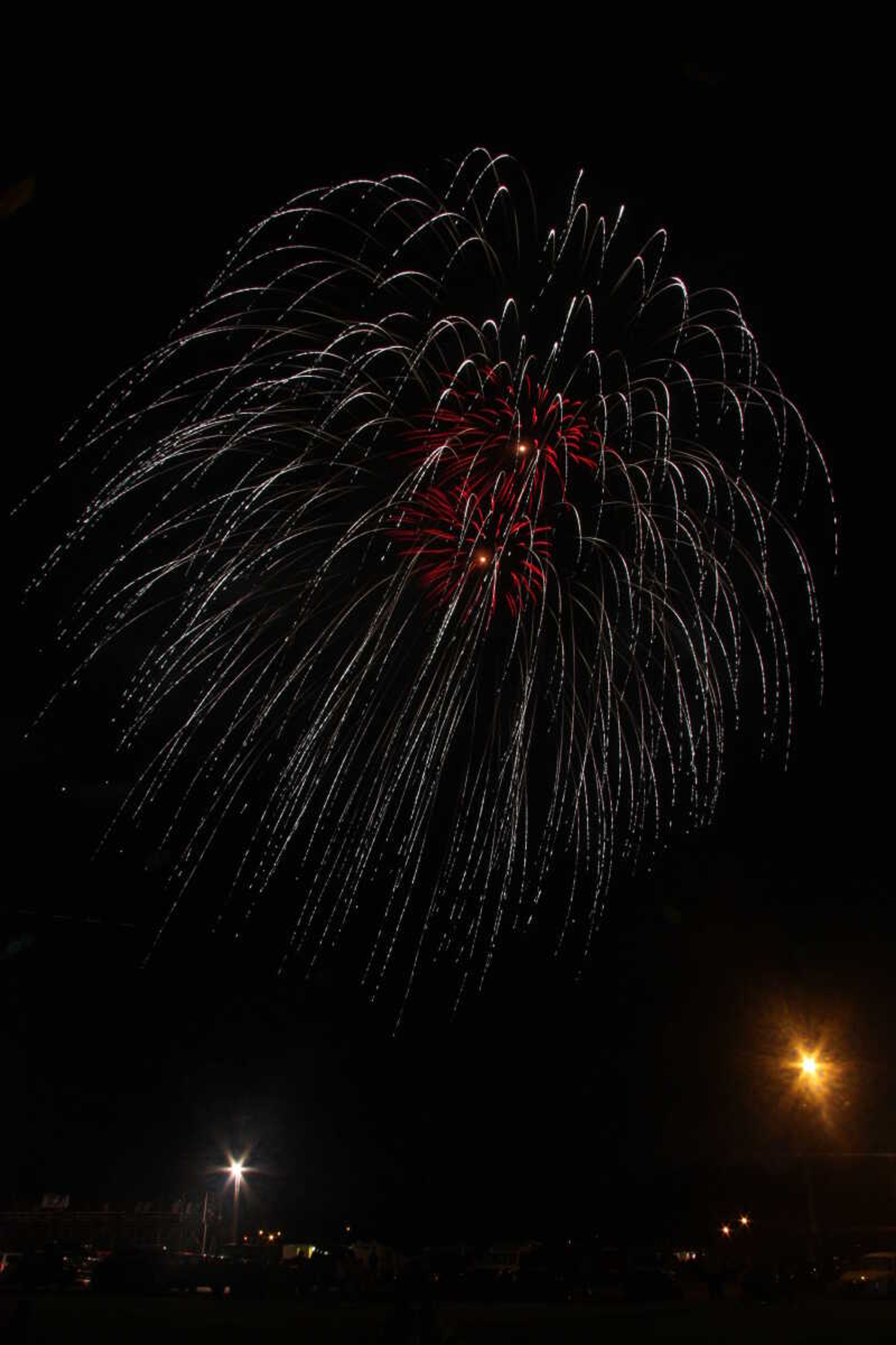 Picture of the fireworks display in Cape Girardeau's Arena Park, taken from a field south of the park.