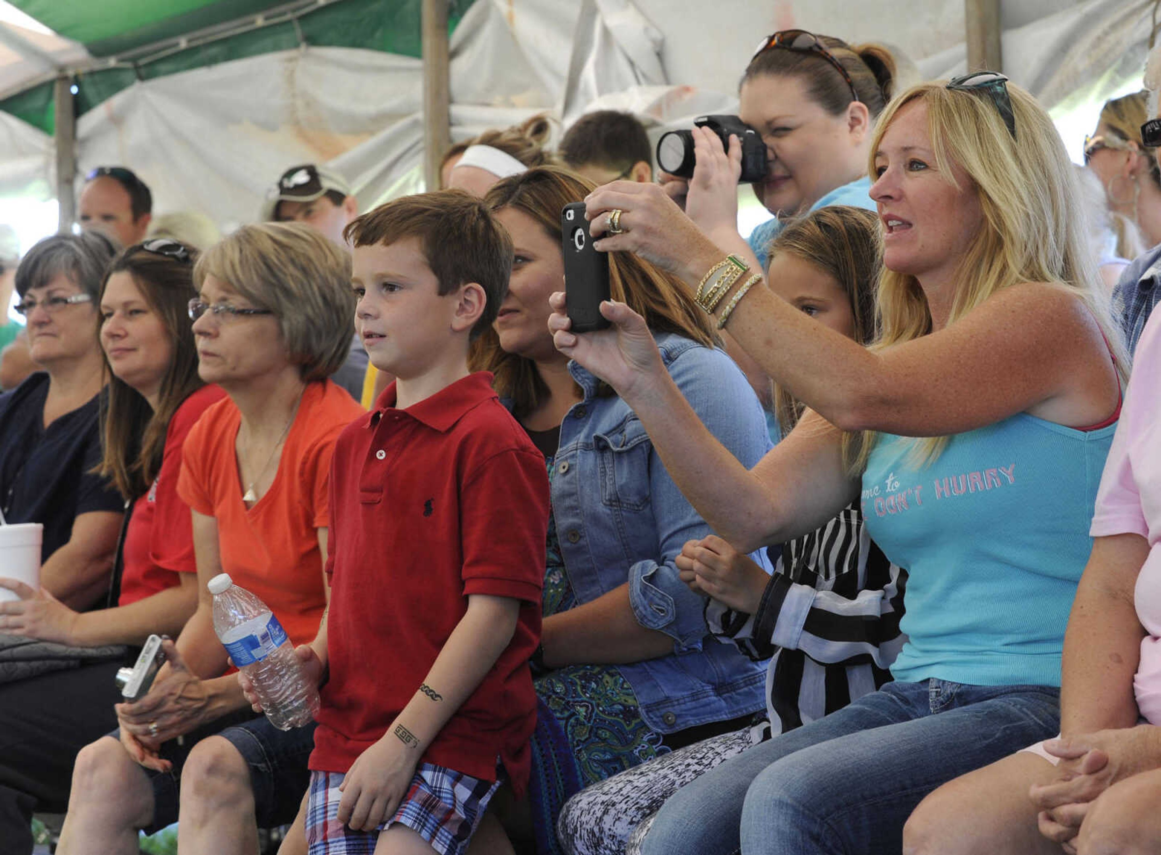 Spectators watch the poultry dress-up contest Sunday, Sept. 7, 2014 at the SEMO District Fair.