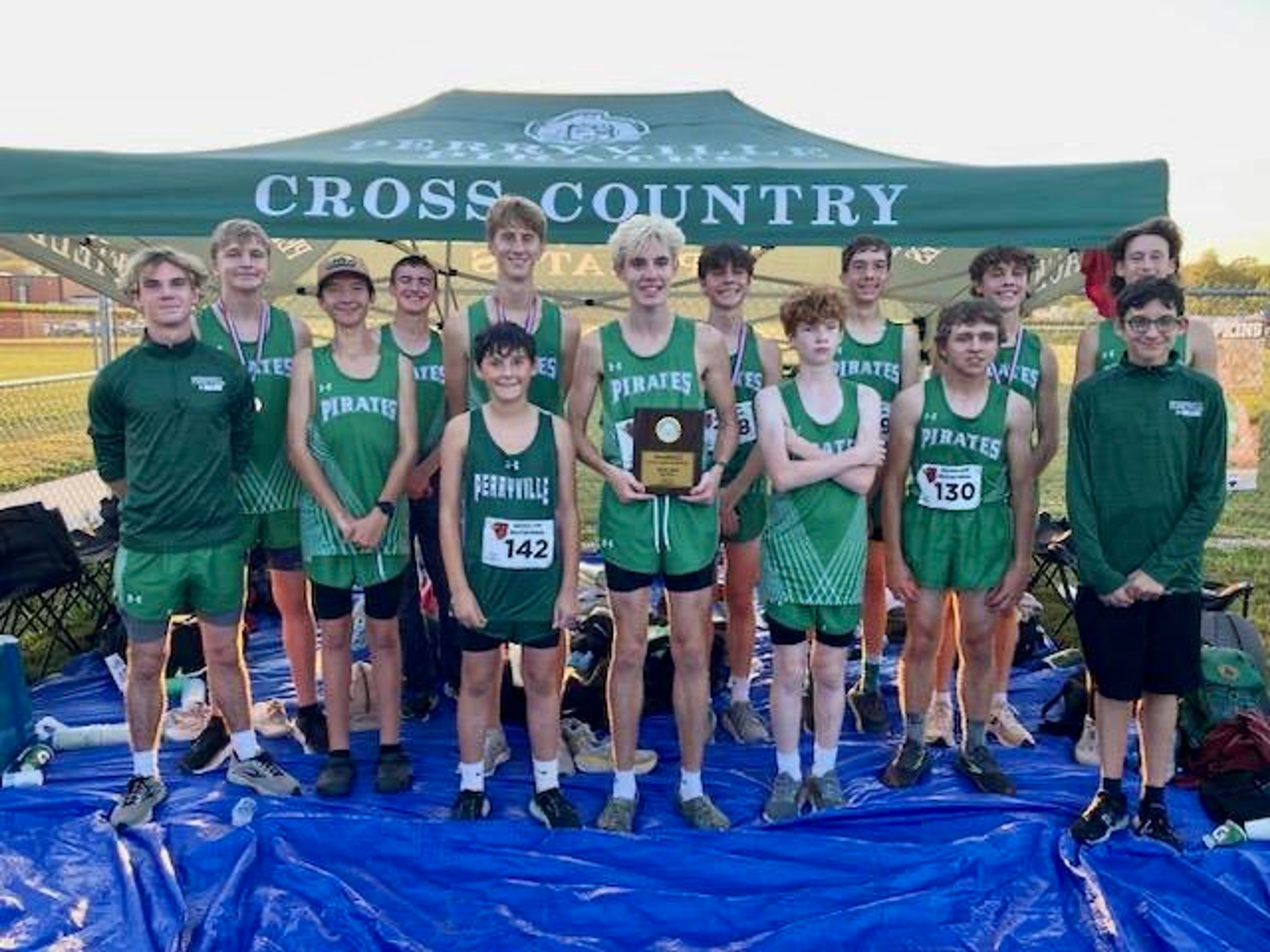 The Perryville boys cross country team pose with the first place trophy at the Woodland Invitational on Thursday, Oct. 10, in Marble Hill. 