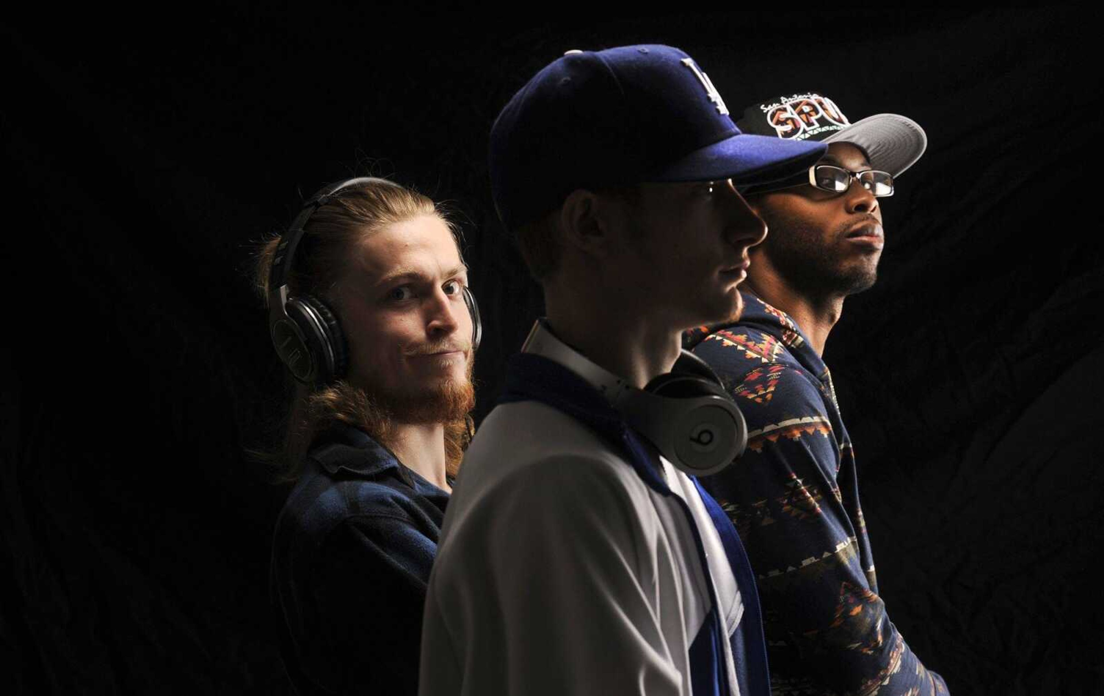 Angelo "Gelo" Wilson, left, Nik "Niko Scarpy" Scarpaci, center, and Amir "Amiricle" Waters of hip-hop group Imaginary Friends pose for a photo Wednesday.