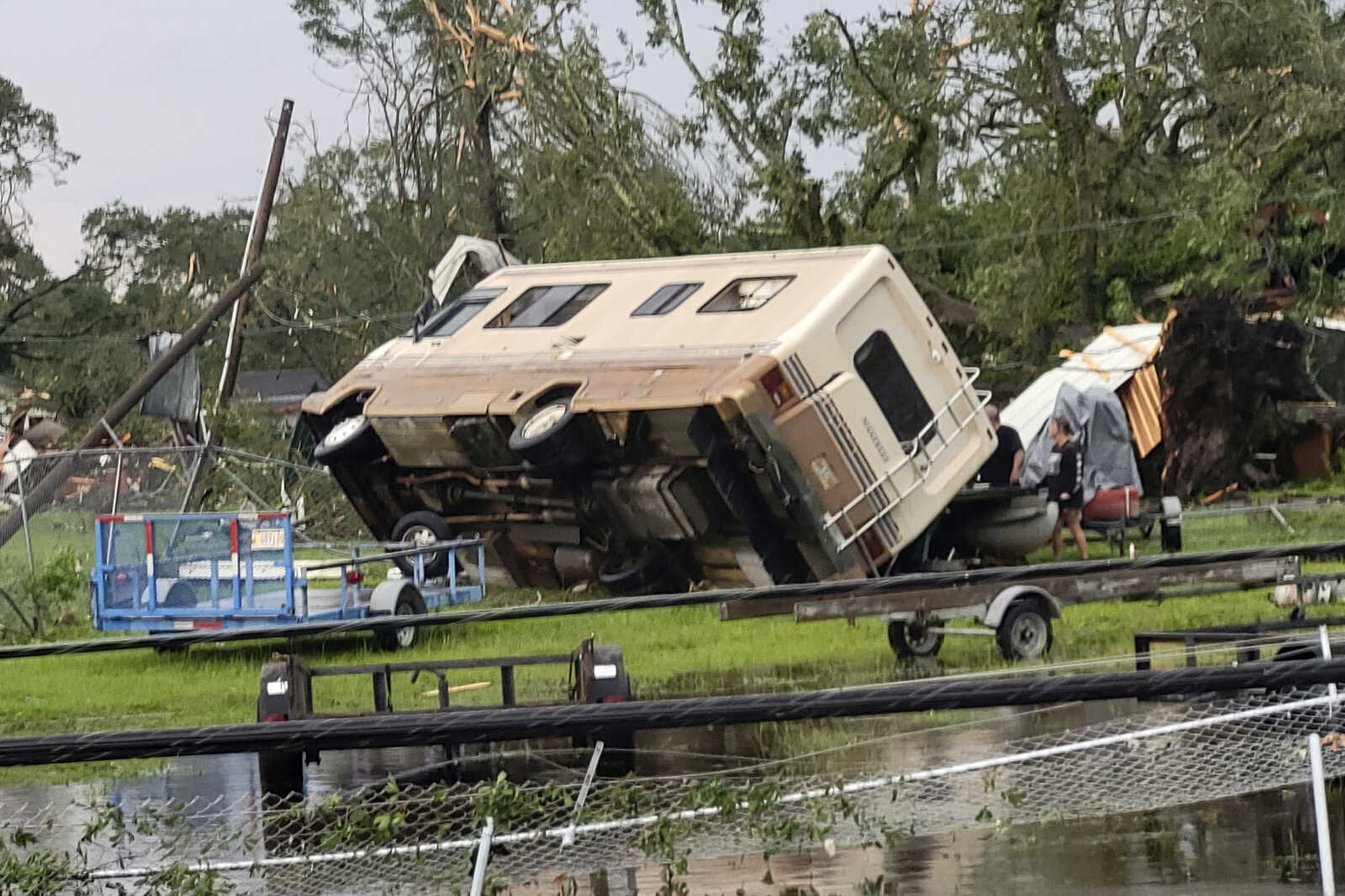 A mobile home is turned on its side off Main Street in Moss Point, Miss., after a tornado struck the town, Monday, June 19, 2023. (Blake Kaplan/The Sun Herald via AP)