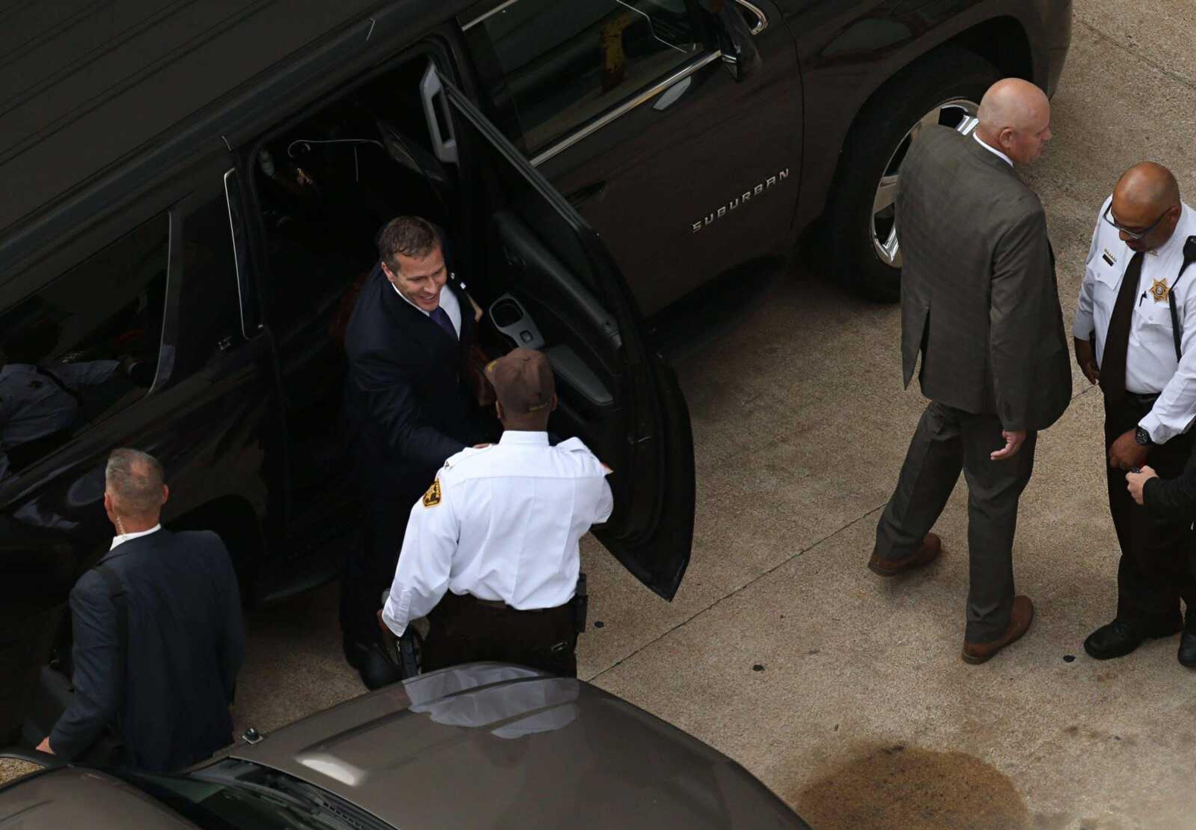 Missouri Gov. Eric Greitens, top, arrives at court for jury selection in his felony invasion of privacy trial Thursday in St. Louis. Greitens is accused of taking an unauthorized and compromising photo of a woman with whom he had an affair.