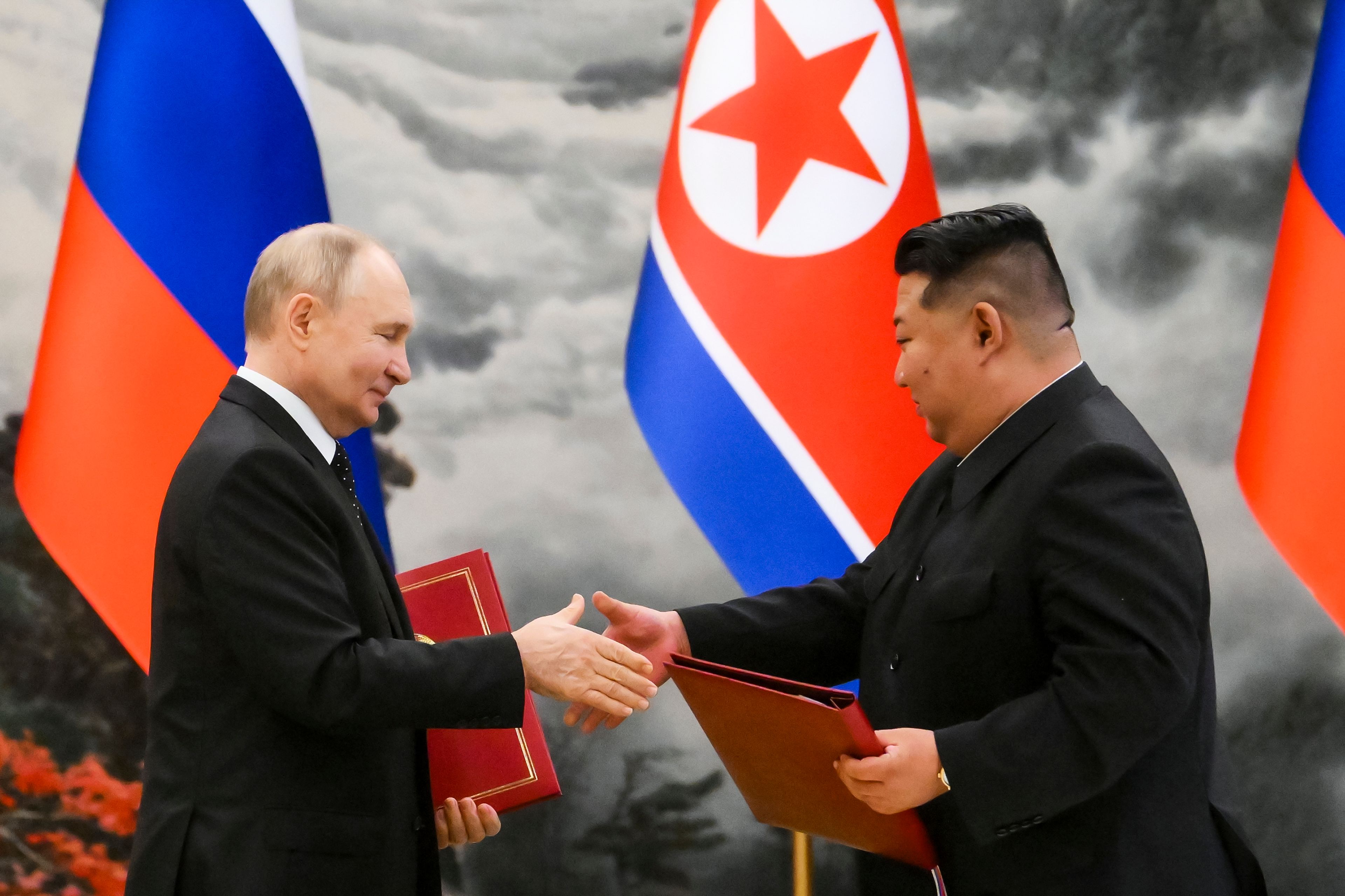 FILE - Russian President Vladimir Putin, left, and North Korea's leader Kim Jong Un exchange documents during a signing ceremony of the new partnership in Pyongyang, North Korea, on June 19, 2024. (Kristina Kormilitsyna, Sputnik, Kremlin Pool Photo via AP, File)