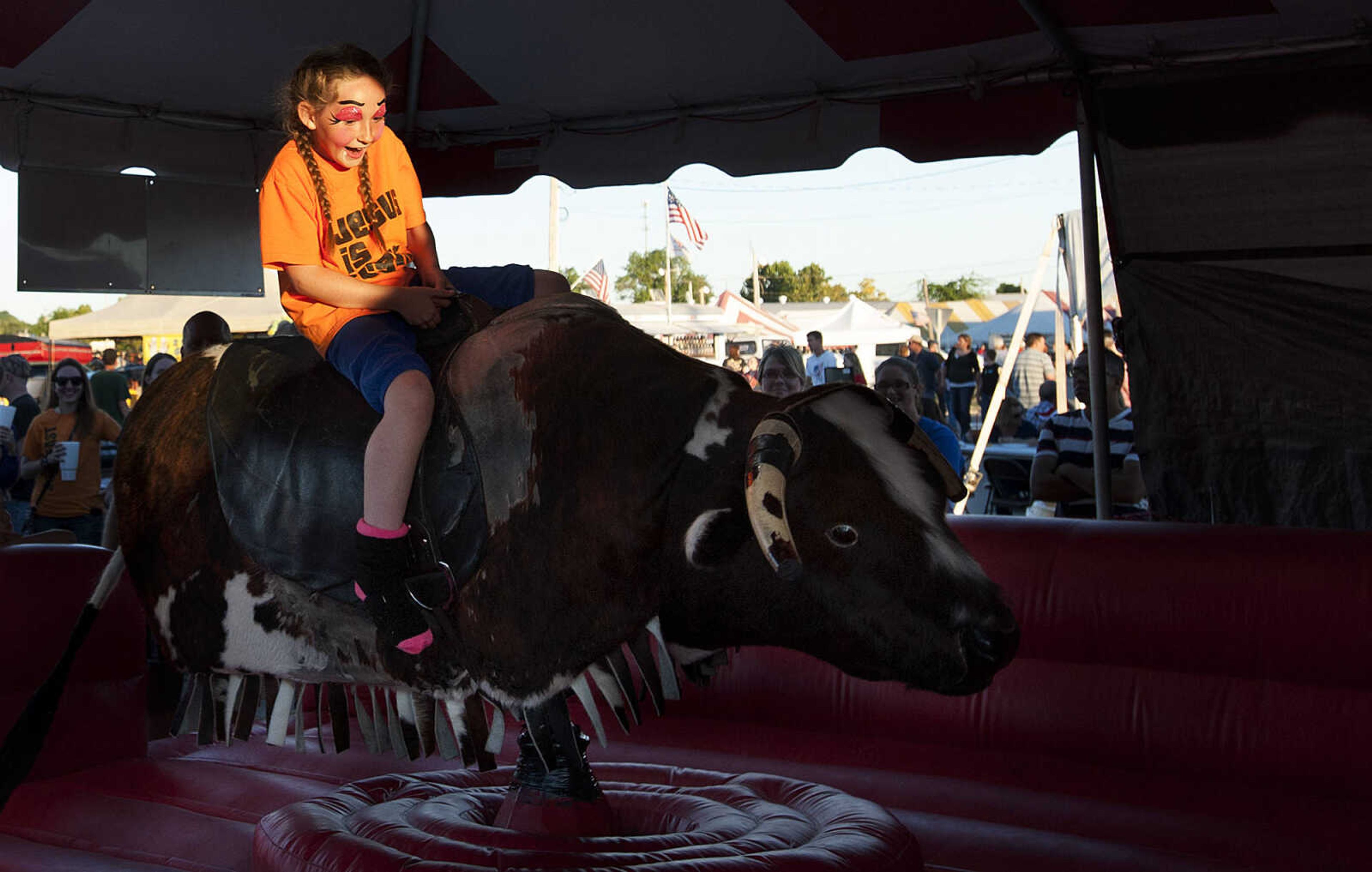 ADAM VOGLER ~ avogler@semissourian.com
Delta Lindley, 8, of Marble Hill rides a mechanical bull at the SEMO District Fair Saturday, Sept. 14, at Arena Park in Cape Girardeau.